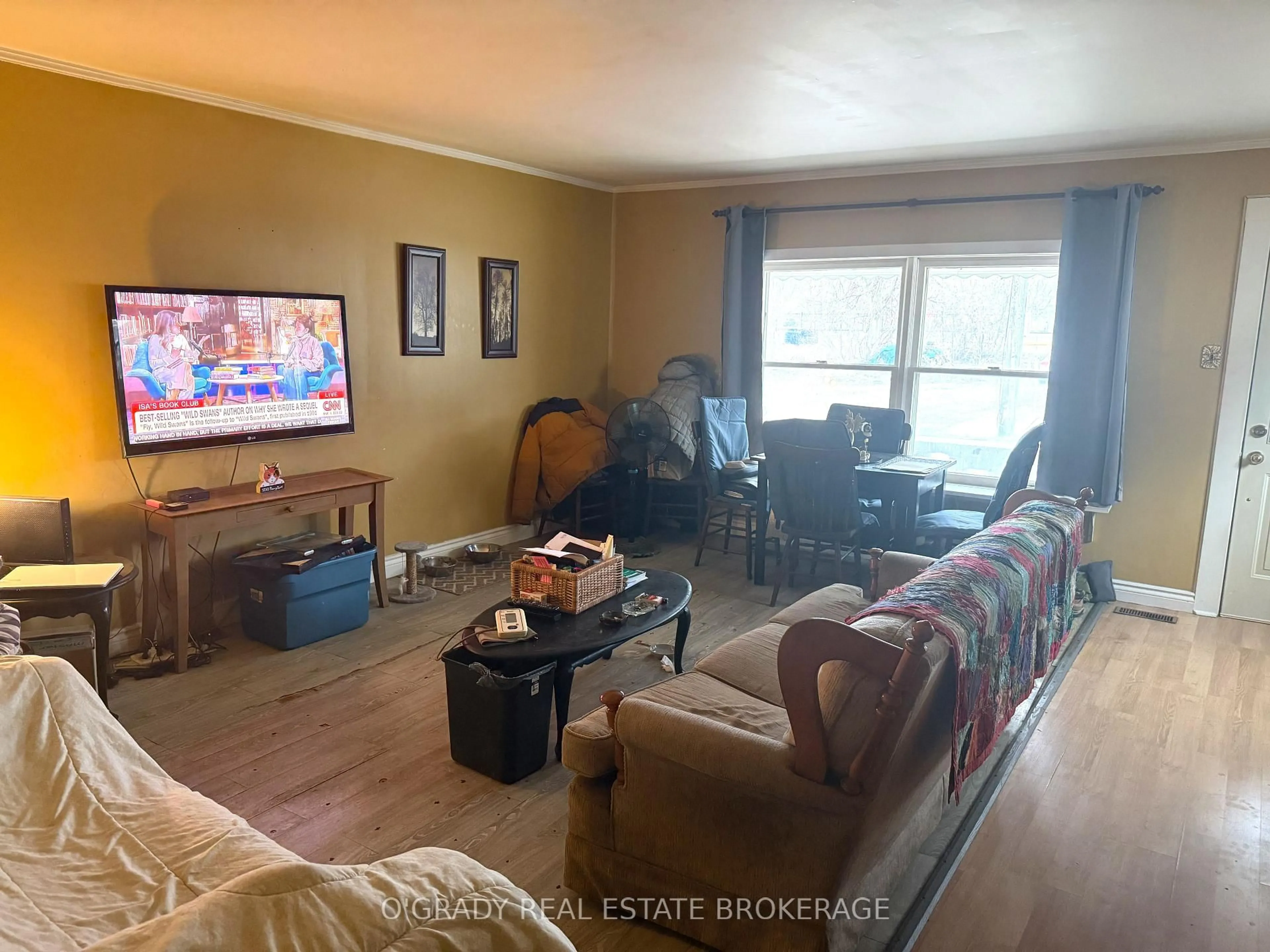 Living room with furniture, wood/laminate floor for 76 Louis St, Brockville Ontario K6V 4H6