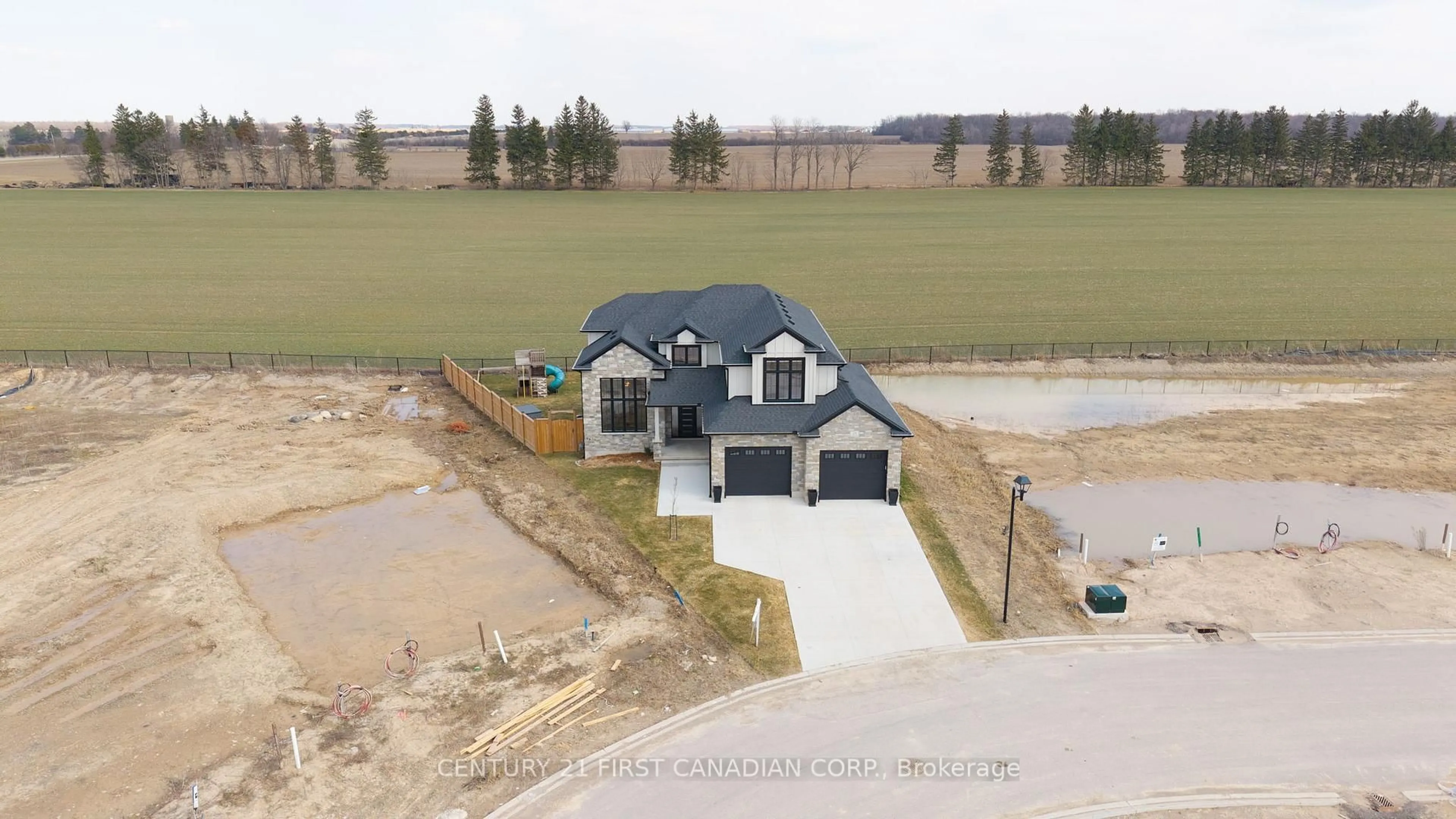 A pic from outside/outdoor area/front of a property/back of a property/a pic from drone, water/lake/river/ocean view for 24 Postma Cres, North Middlesex Ontario N0M 1A0