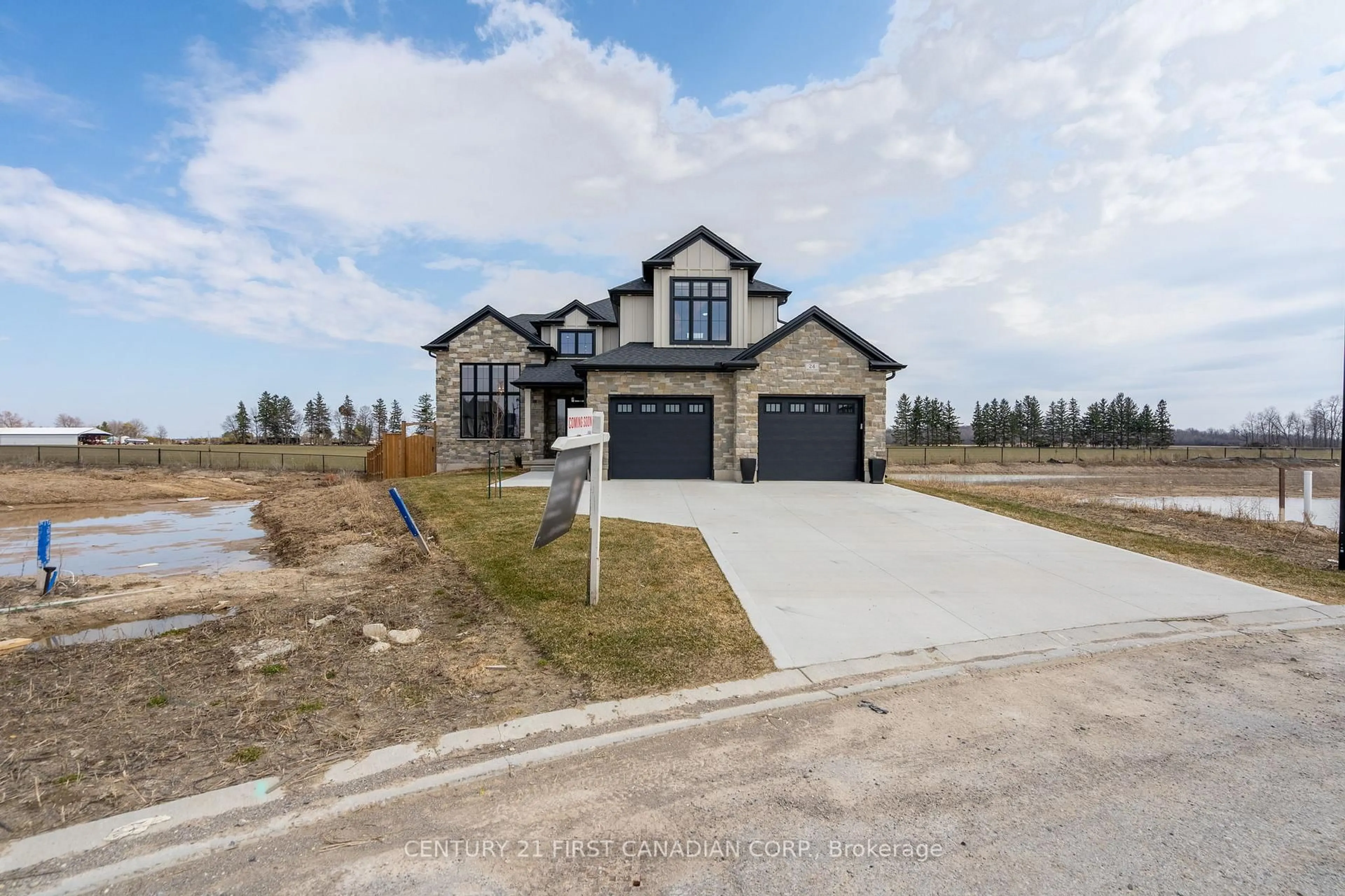 A pic from outside/outdoor area/front of a property/back of a property/a pic from drone, street for 24 Postma Cres, North Middlesex Ontario N0M 1A0