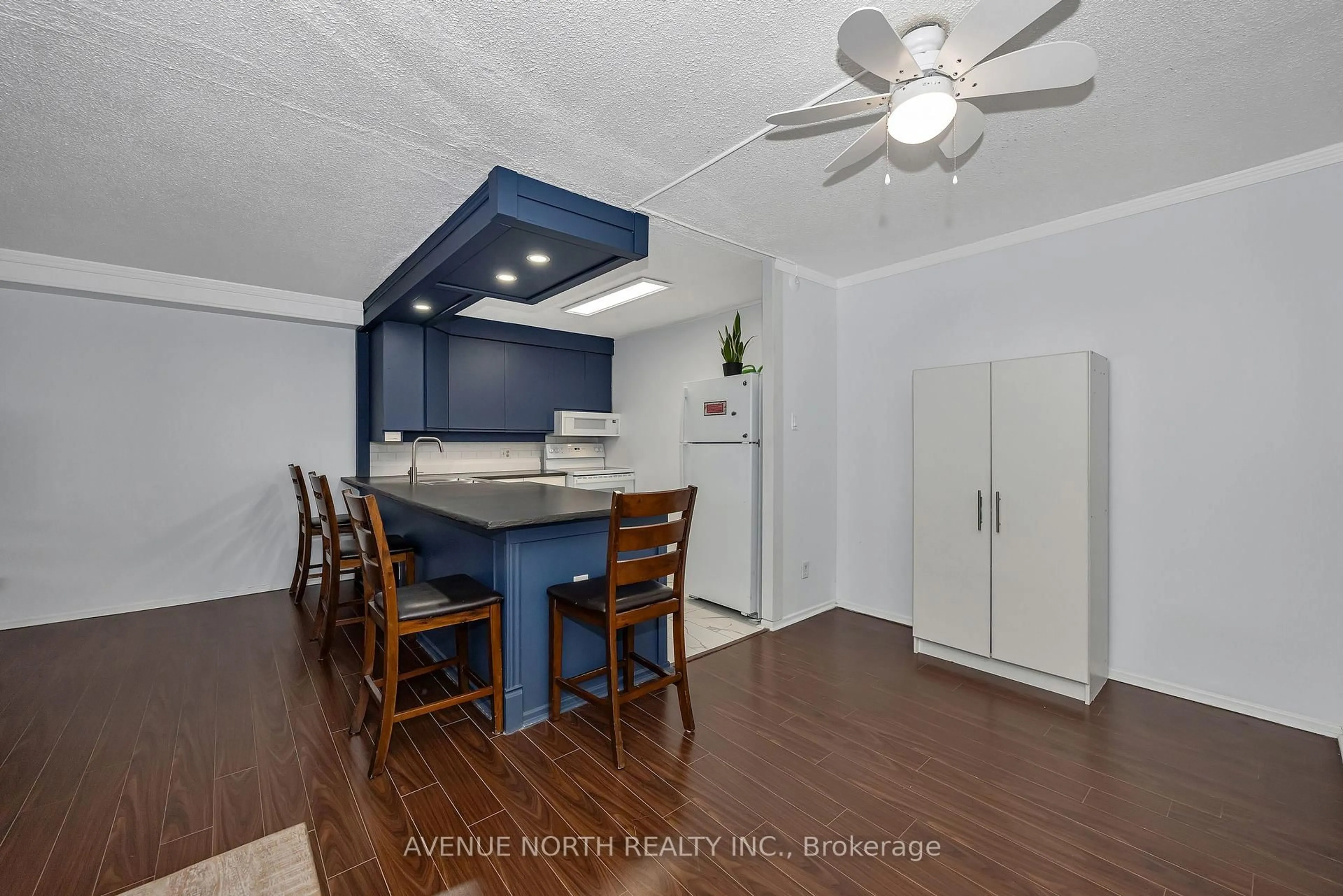 Open concept kitchen, wood/laminate floor for 900 Dynes Rd #308, Ottawa Ontario K2C 3L6