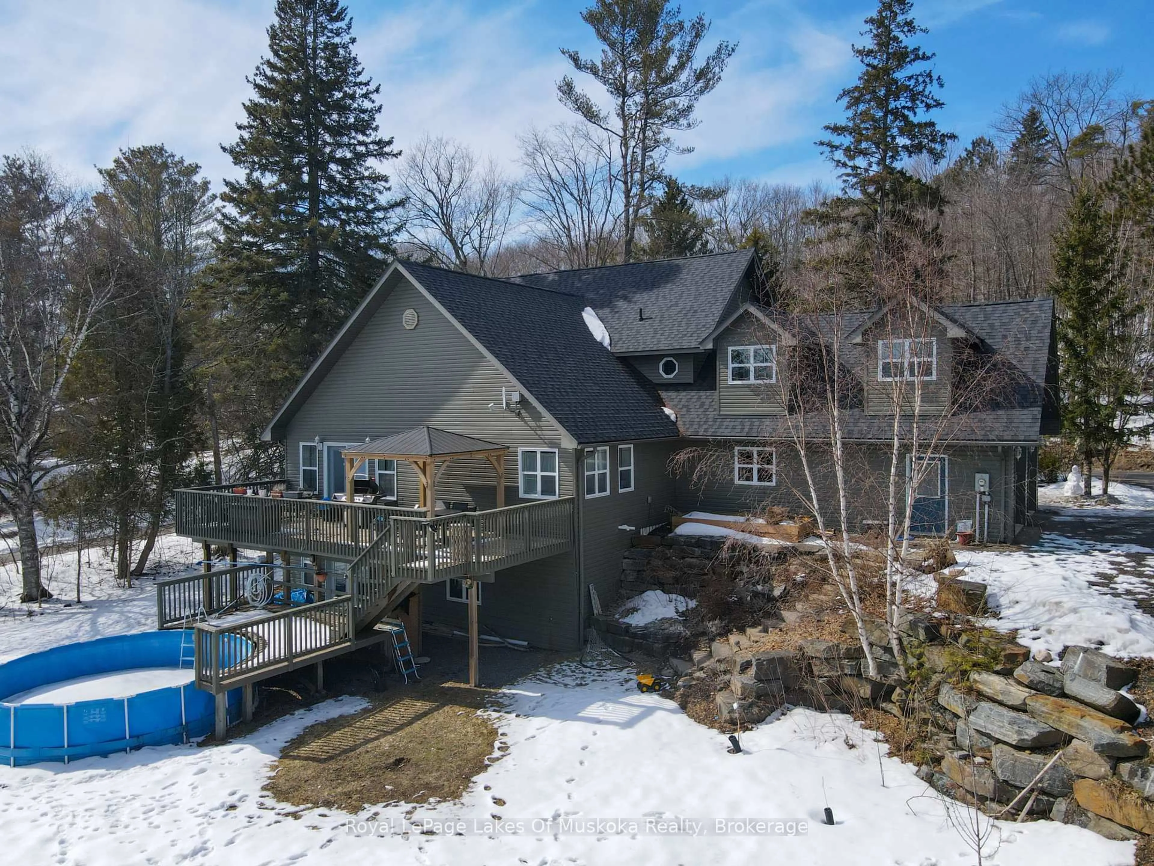 A pic from outside/outdoor area/front of a property/back of a property/a pic from drone, water/lake/river/ocean view for 317 Falcon Rd, Huntsville Ontario P1H 1N3