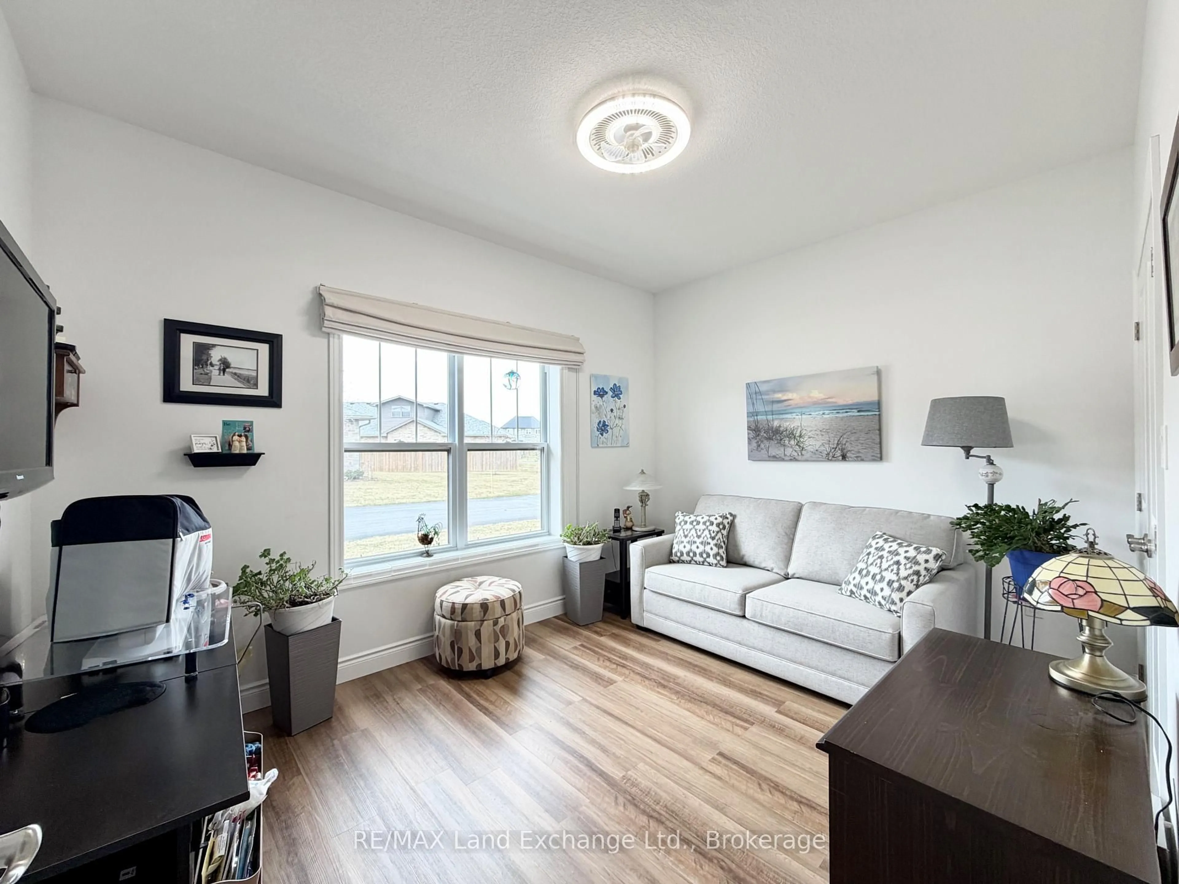 Living room with furniture, wood/laminate floor for 1050 Waterloo St #30, Saugeen Shores Ontario N0H 2C3