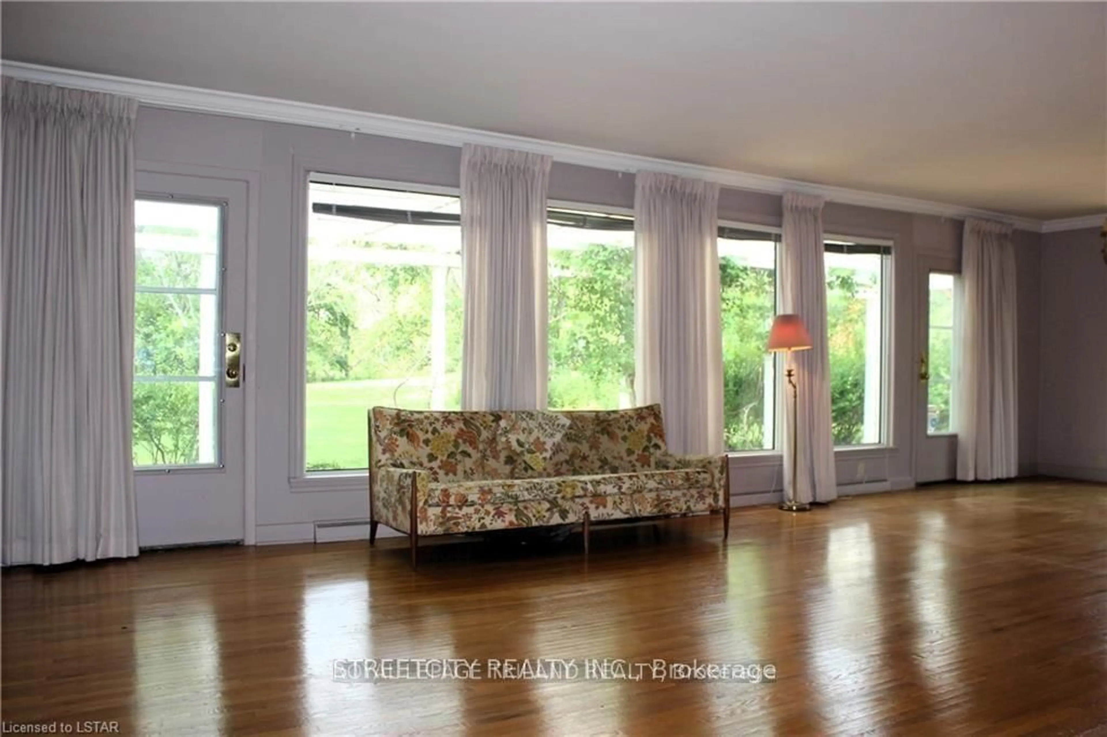 Living room with furniture, wood/laminate floor for 1517 Gloucester Rd, London North Ontario N6H 2S5