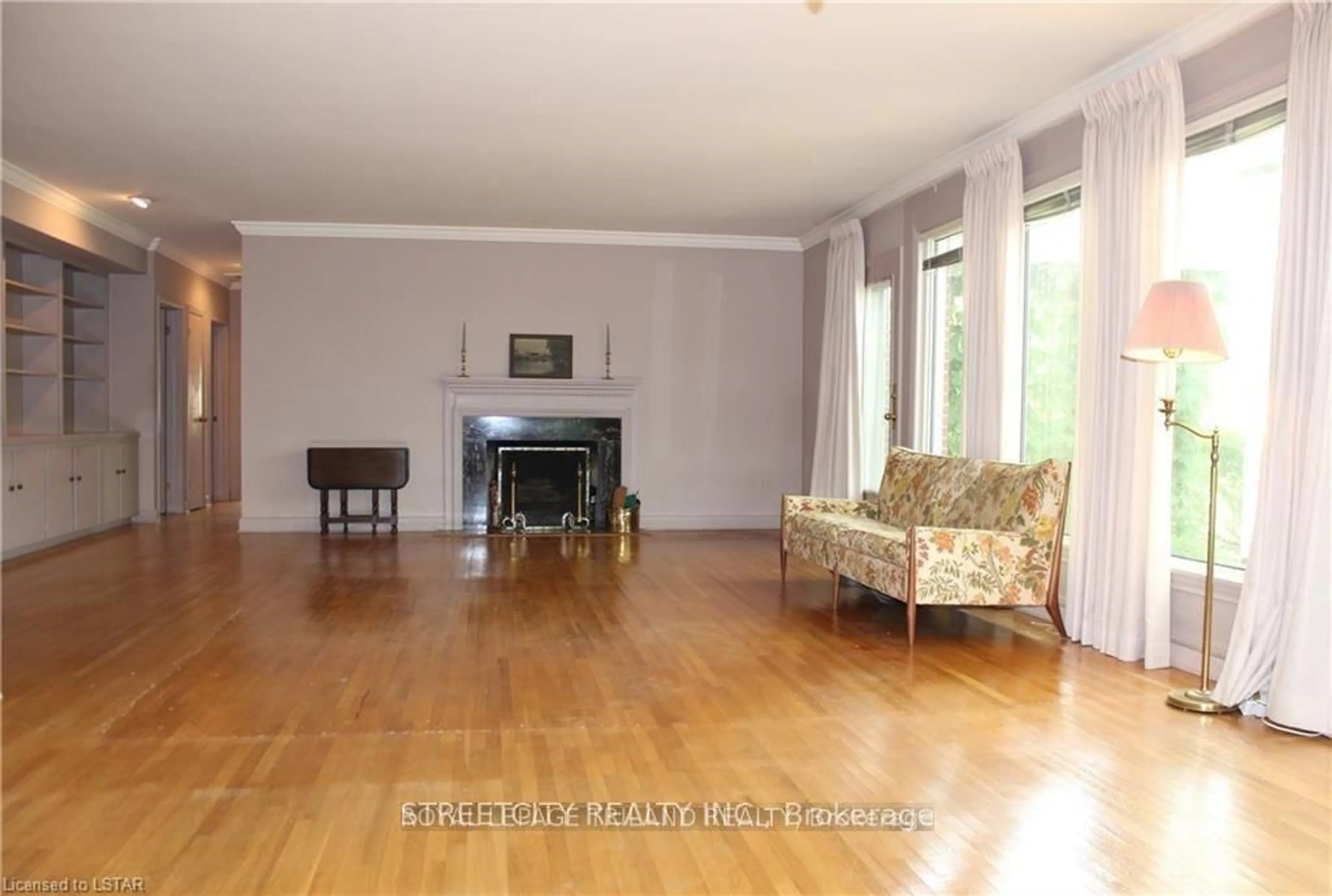 Living room with furniture, wood/laminate floor for 1517 Gloucester Rd, London North Ontario N6H 2S5