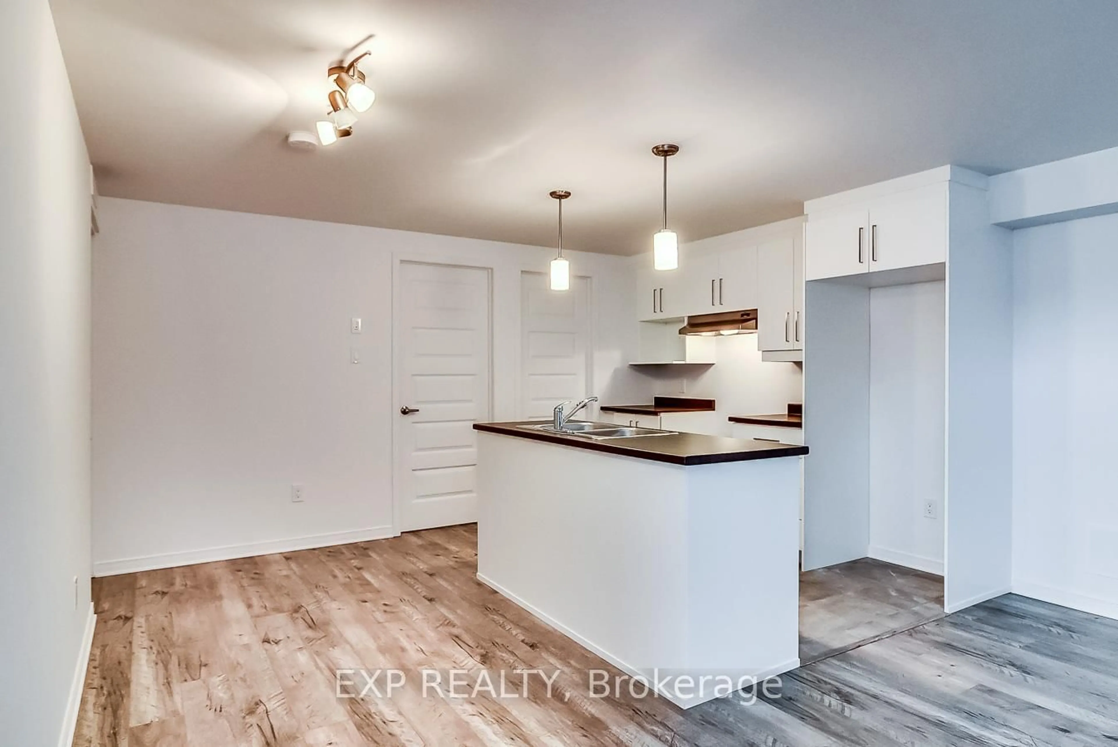 Open concept kitchen, wood/laminate floor for 259 Carpe St, Casselman Ontario K0A 1M0