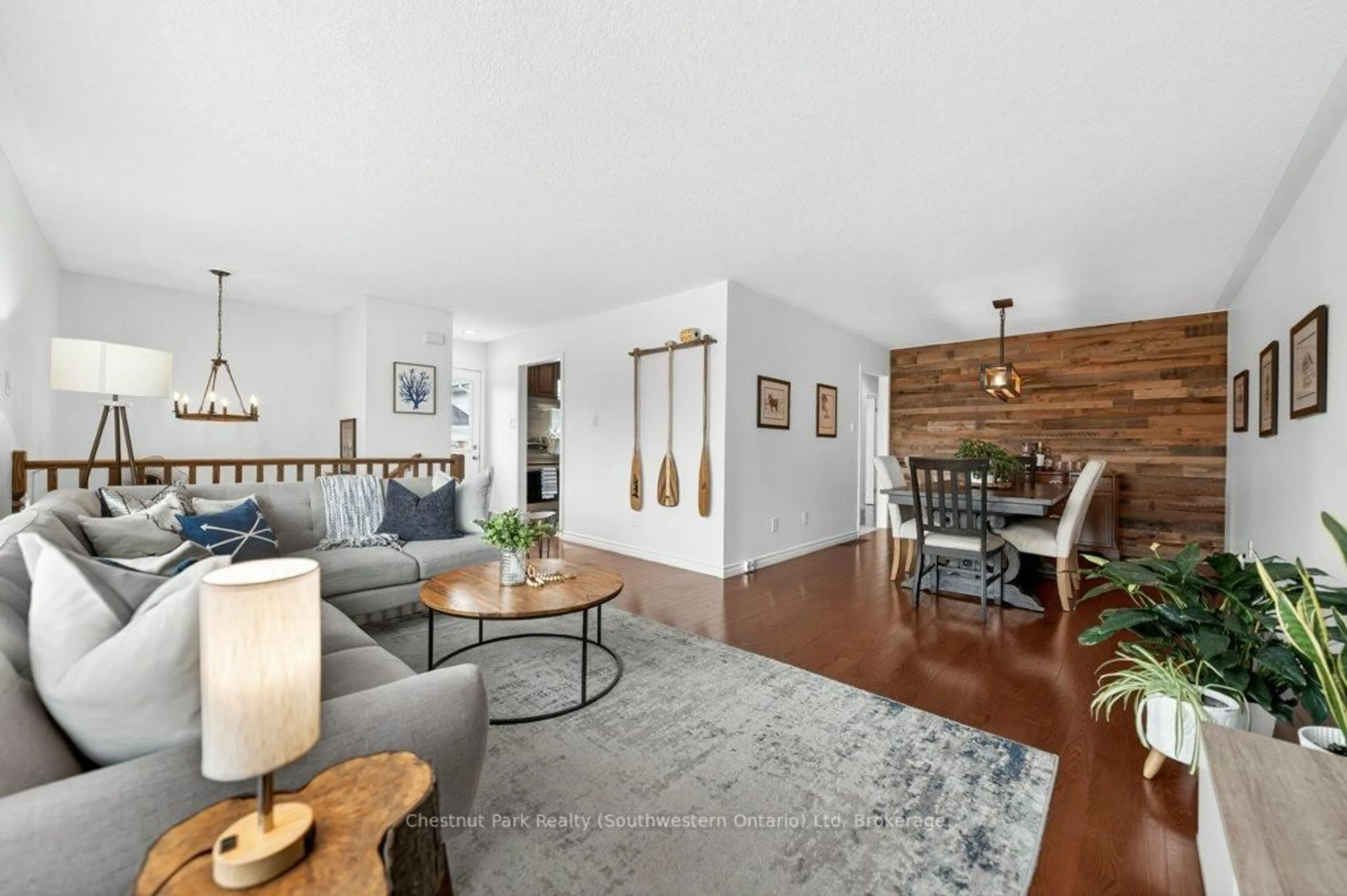 Living room with furniture, wood/laminate floor for 113 Sanderson Dr, Guelph Ontario N1H 7K1