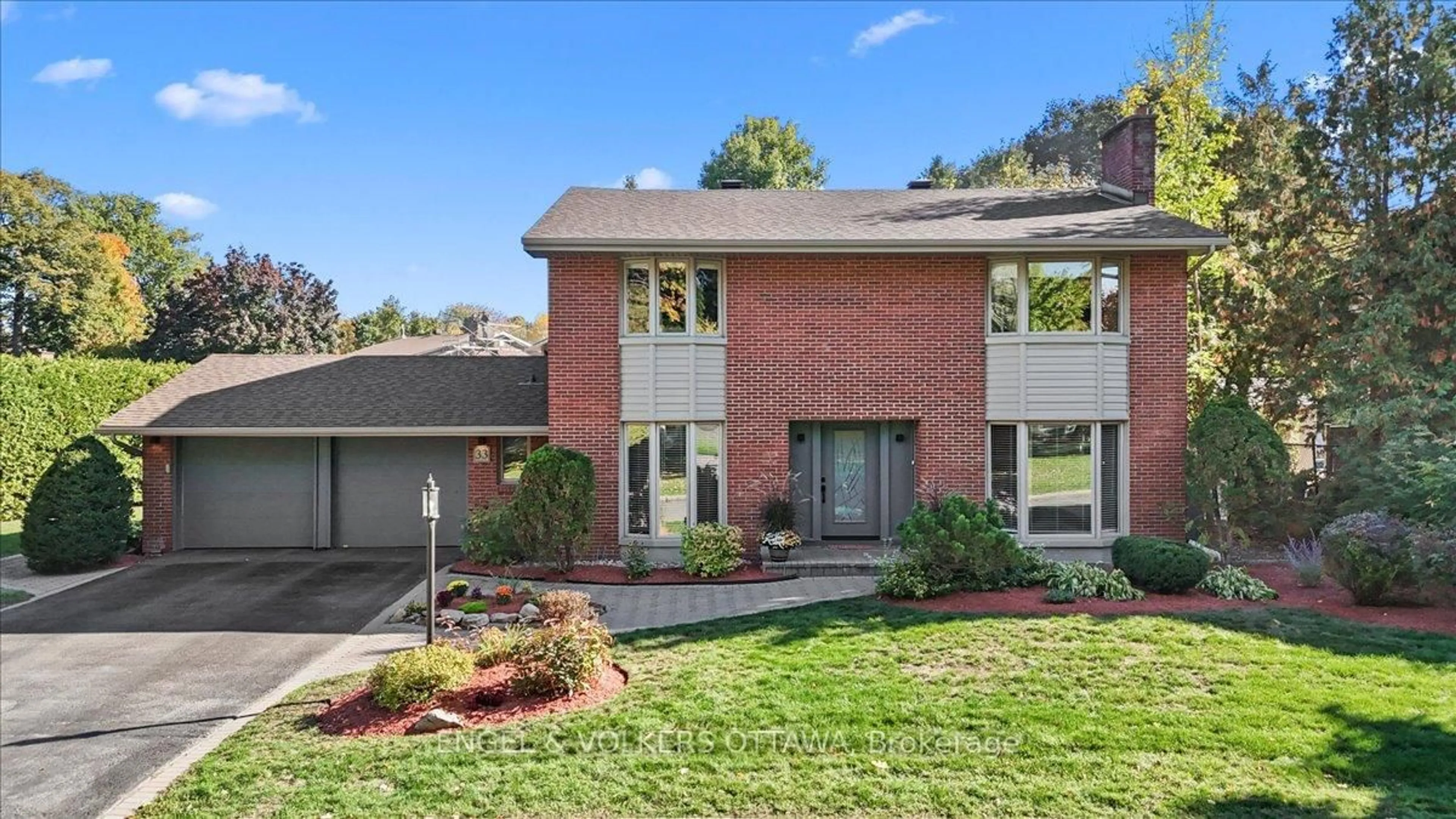Home with brick exterior material, street for 33 Okanagan Dr, Ottawa Ontario K2H 7E9