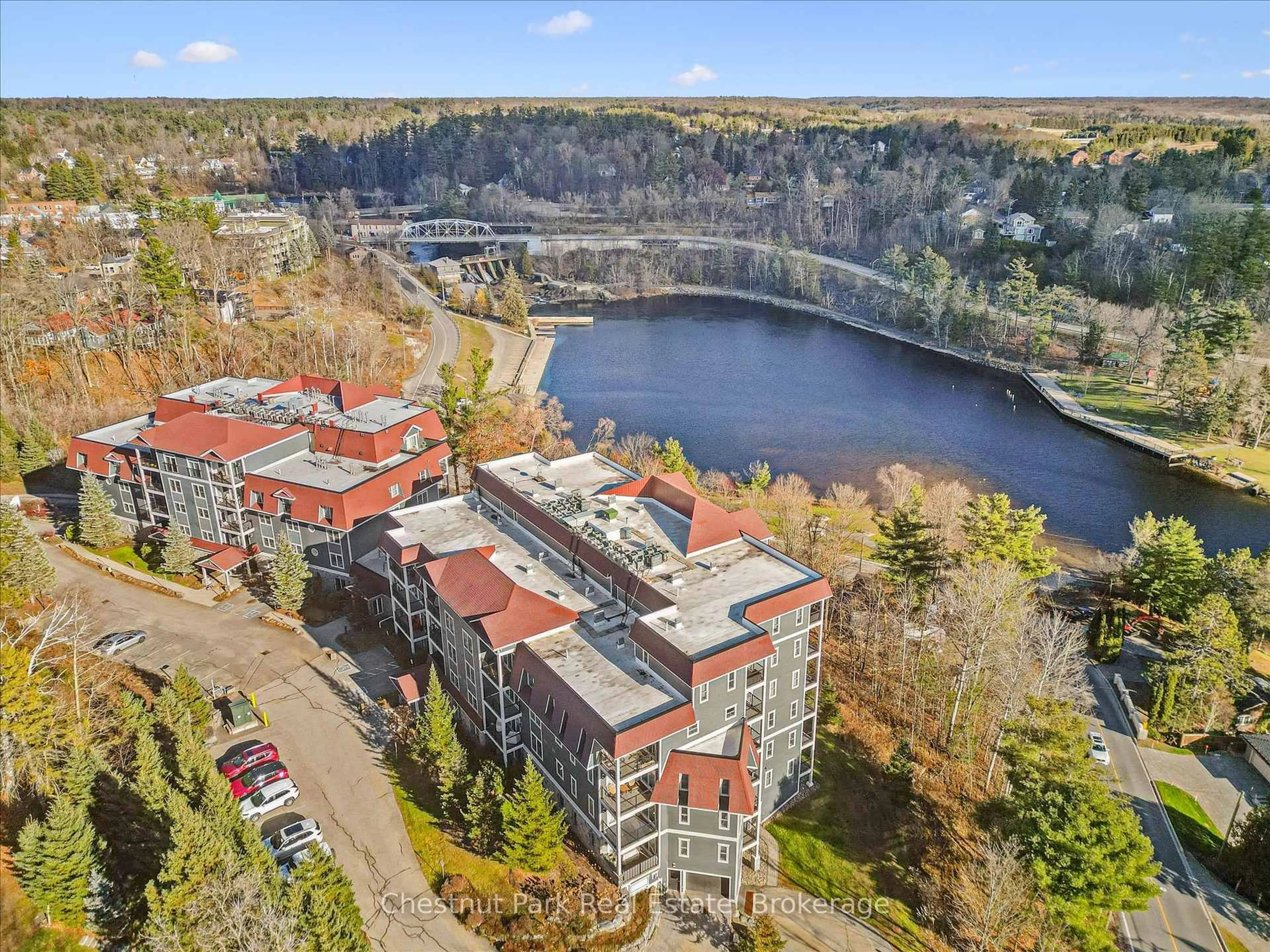 A pic from outside/outdoor area/front of a property/back of a property/a pic from drone, water/lake/river/ocean view for 10B Kimberley Ave #209, Bracebridge Ontario P1L 0A6
