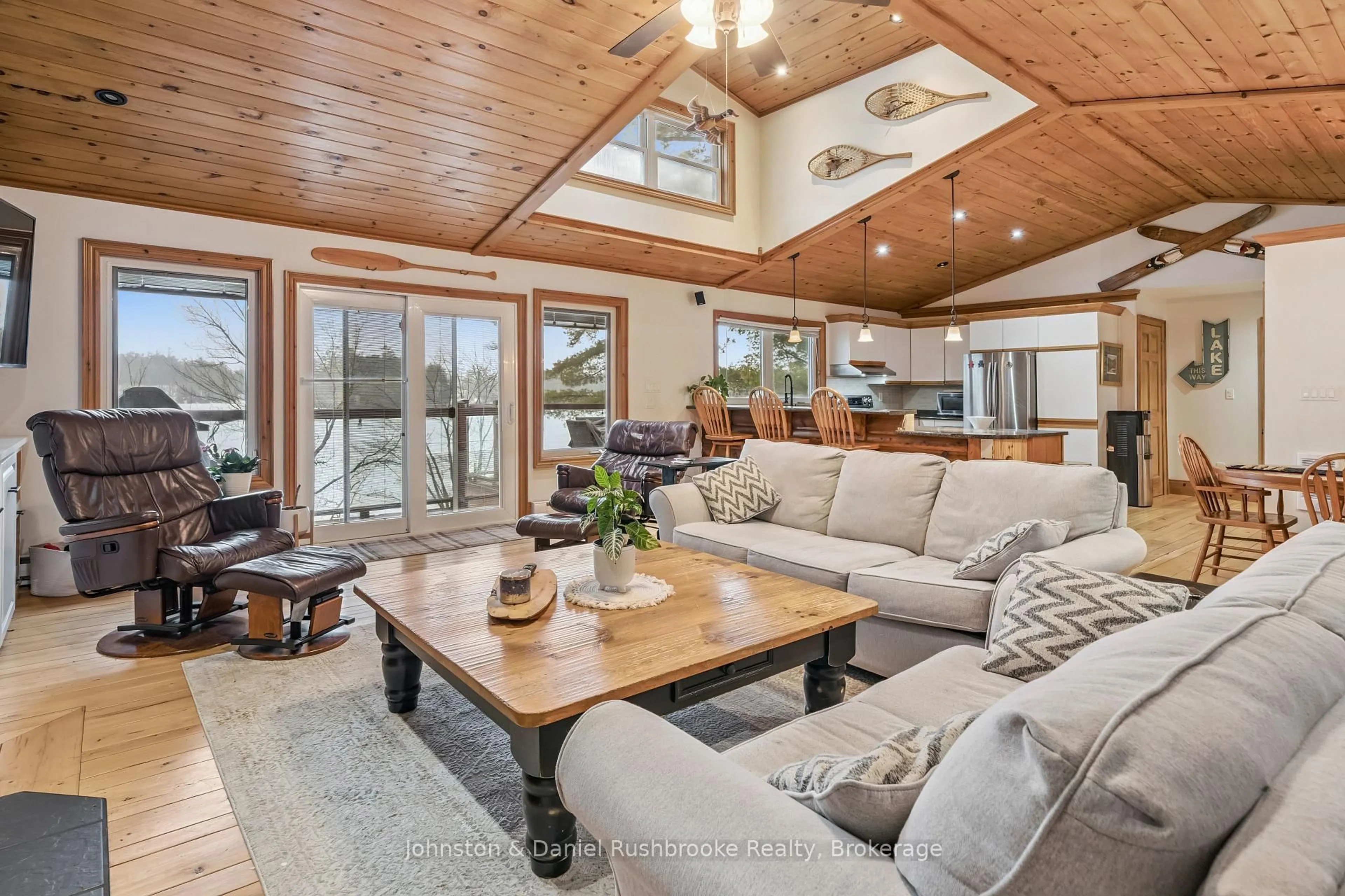 Living room with furniture, wood/laminate floor for 1051 Evanswood Dr, Gravenhurst Ontario P0E 1G0