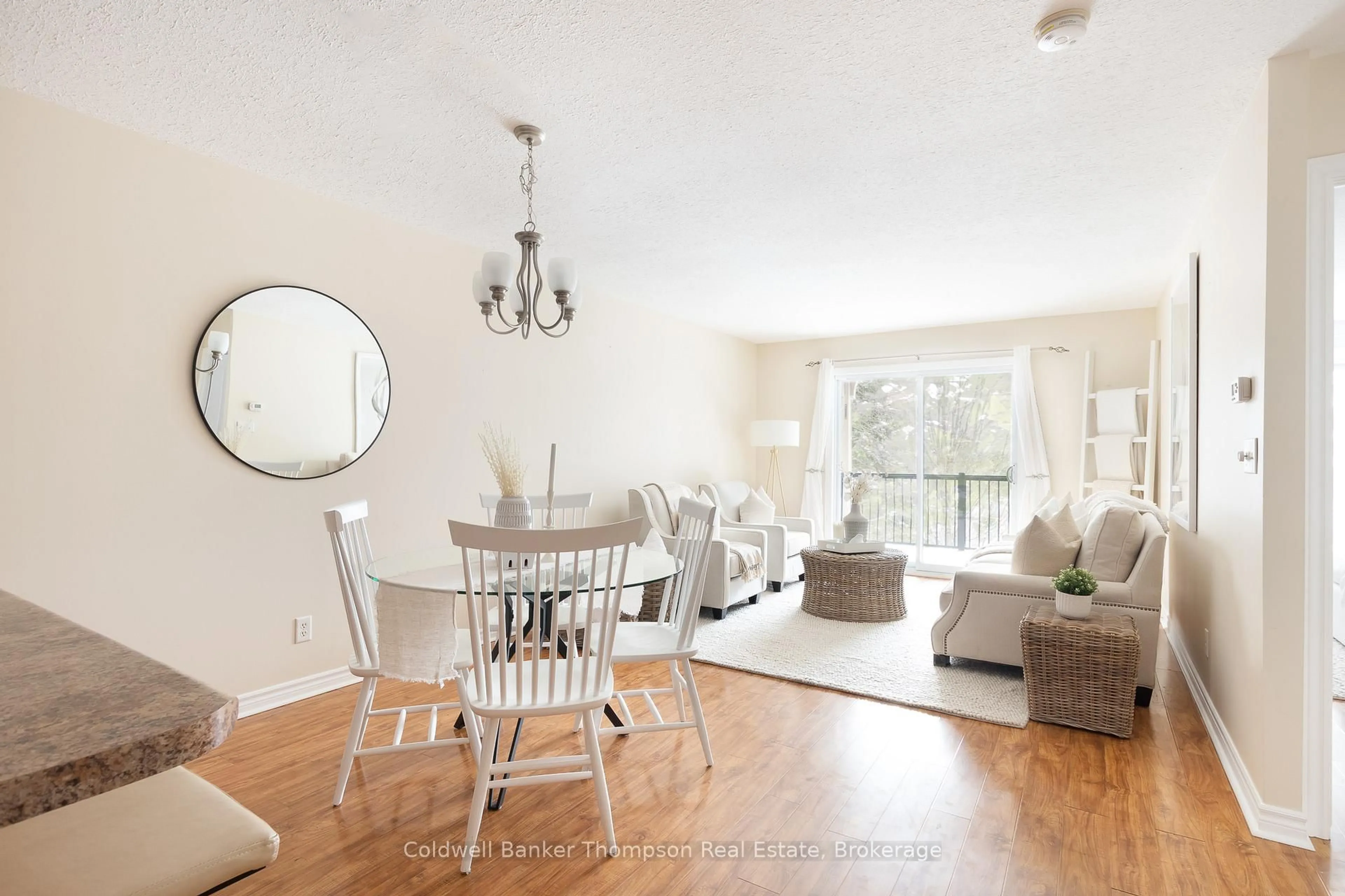 Living room with furniture, wood/laminate floor for 4 Legacy Lane #203, Huntsville Ontario P1H 2R2