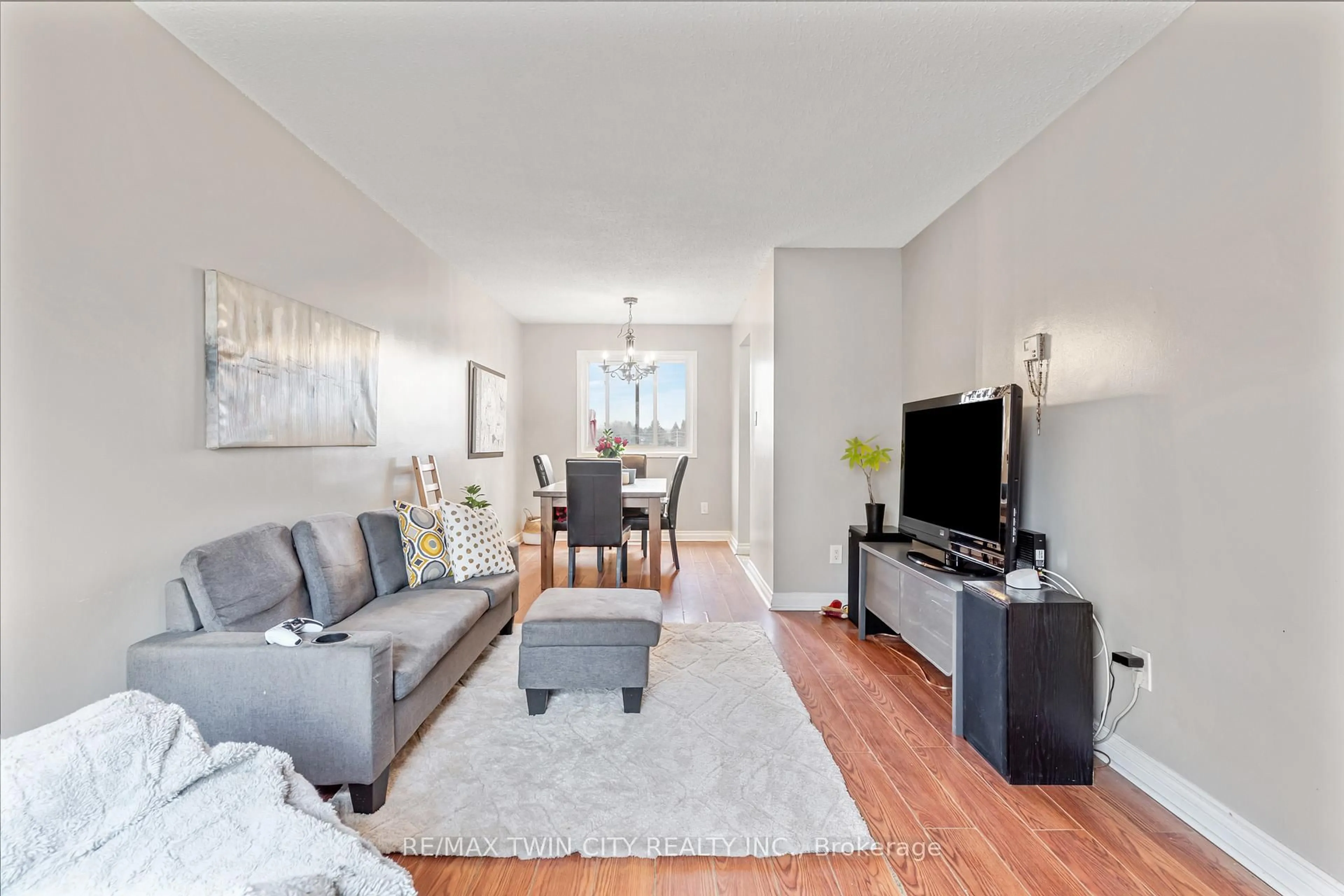 Living room with furniture, wood/laminate floor for 25 Upper Canada Dr #23, Kitchener Ontario N2P 1G2