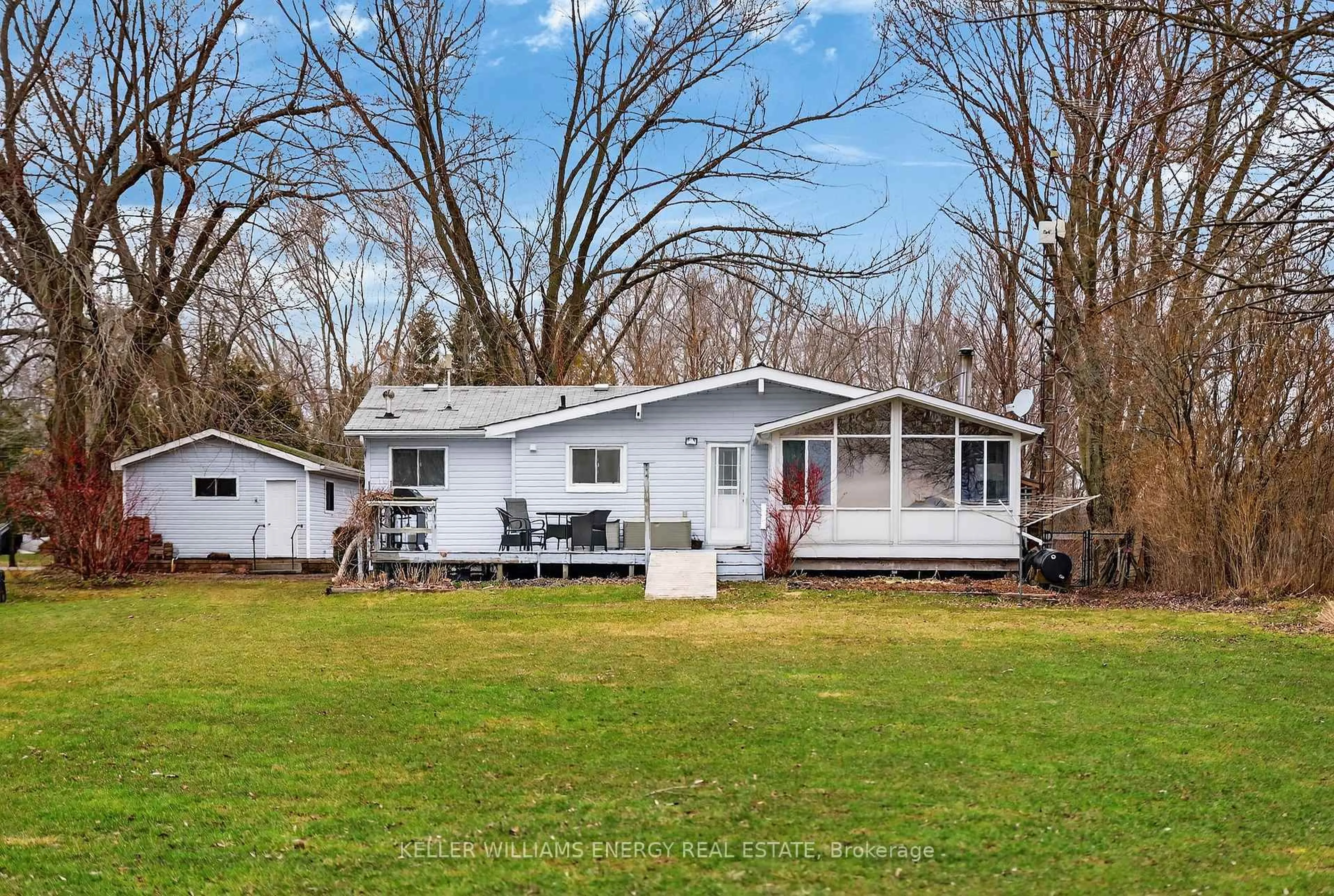 Home with vinyl exterior material, street for 602 Hiscock Shores Rd, Prince Edward County Ontario K0K 1L0