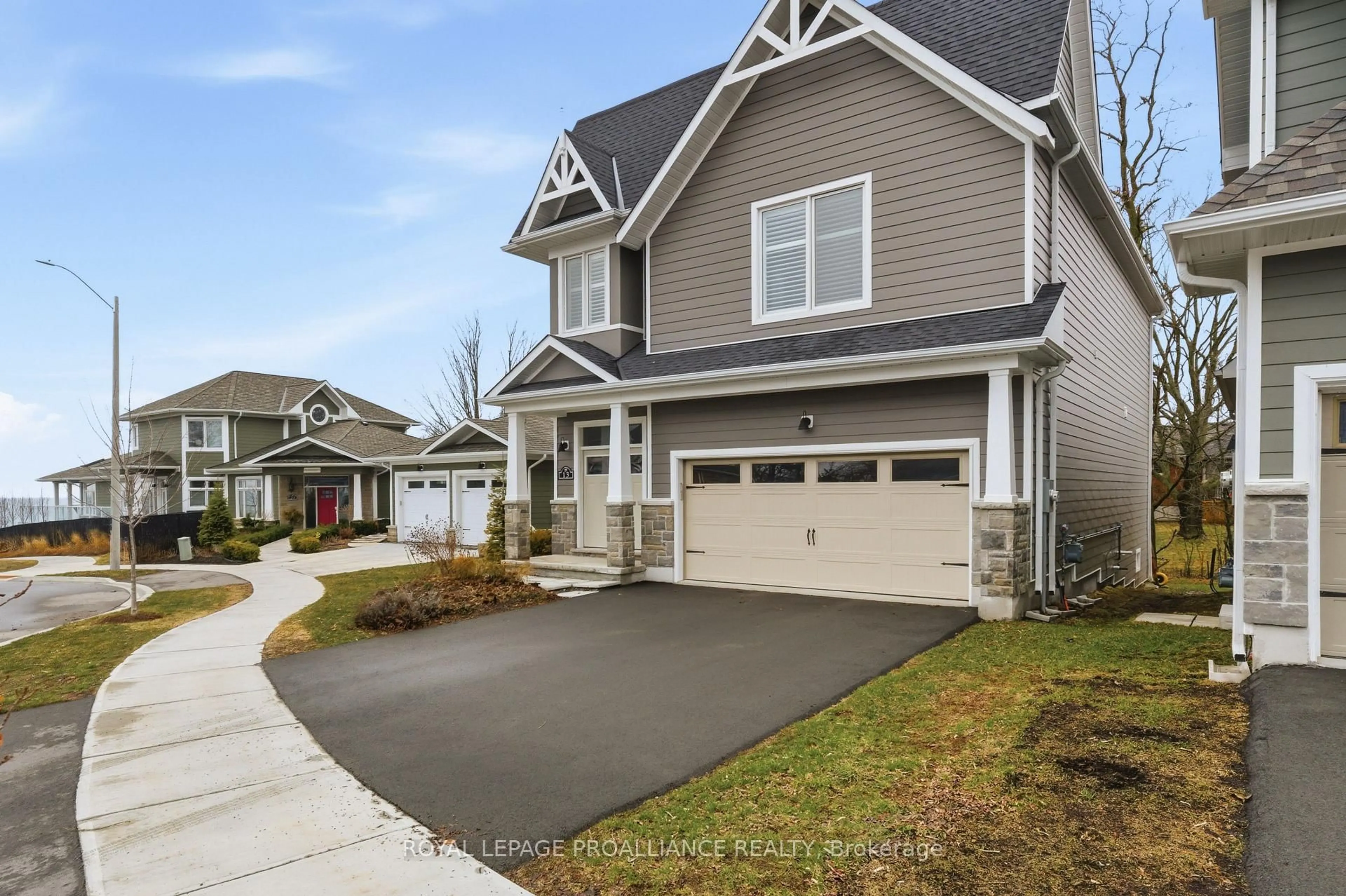 Home with vinyl exterior material, street for 13 Twelve Trees Crt, Prince Edward County Ontario K0K 3L0