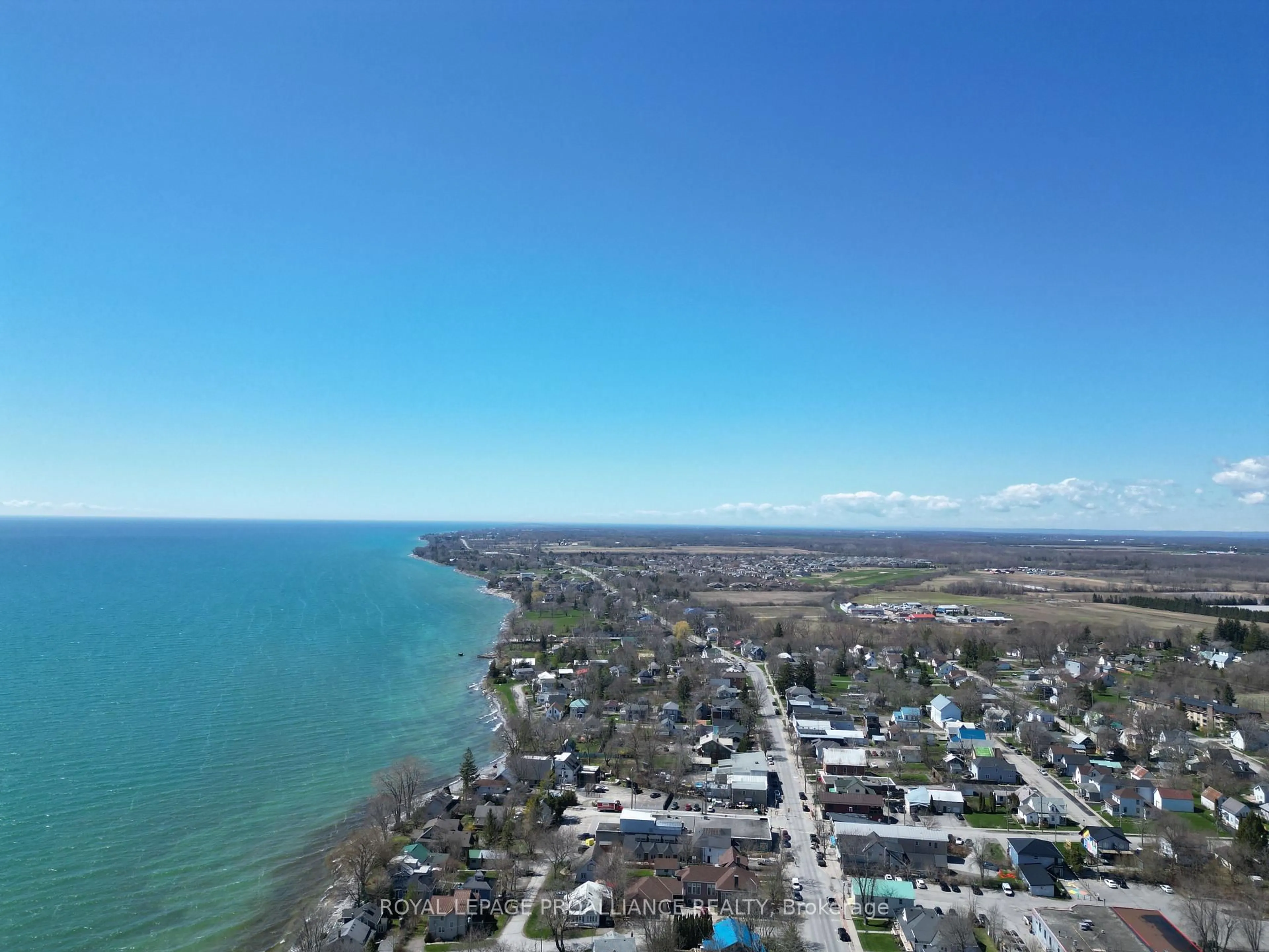 A pic from outside/outdoor area/front of a property/back of a property/a pic from drone, water/lake/river/ocean view for 13 Twelve Trees Crt, Prince Edward County Ontario K0K 3L0
