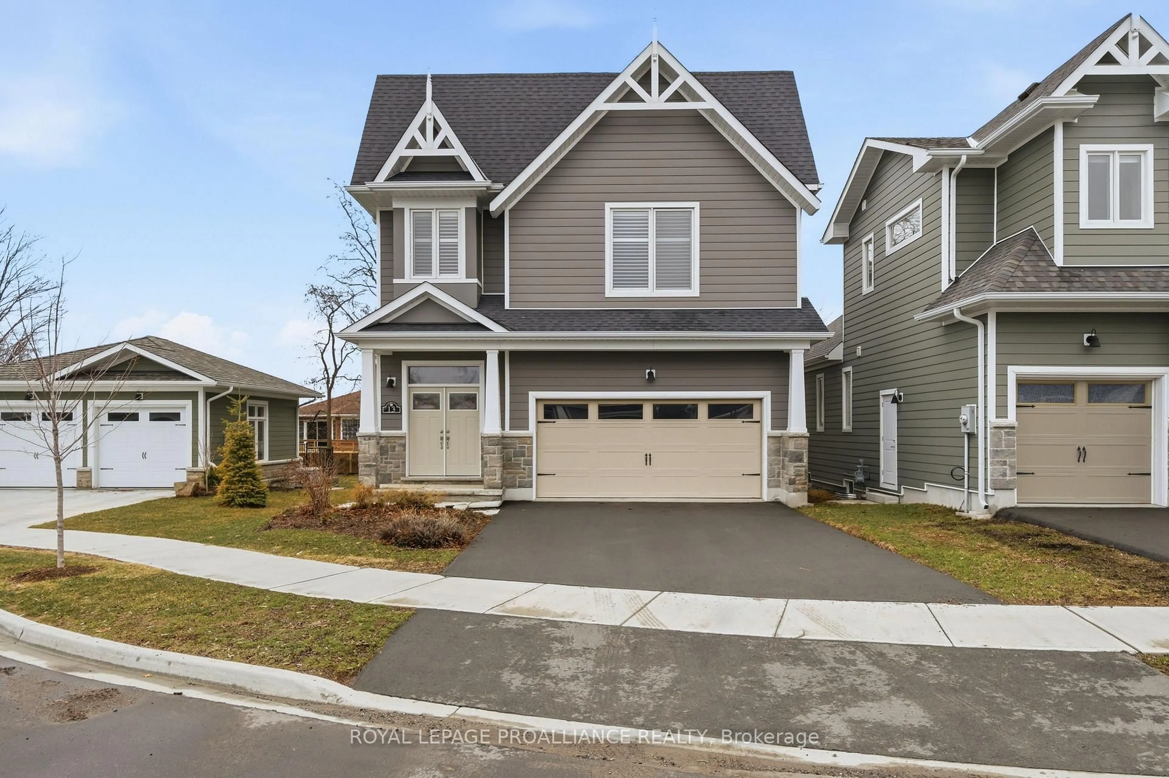 Home with vinyl exterior material, street for 13 Twelve Trees Crt, Prince Edward County Ontario K0K 3L0