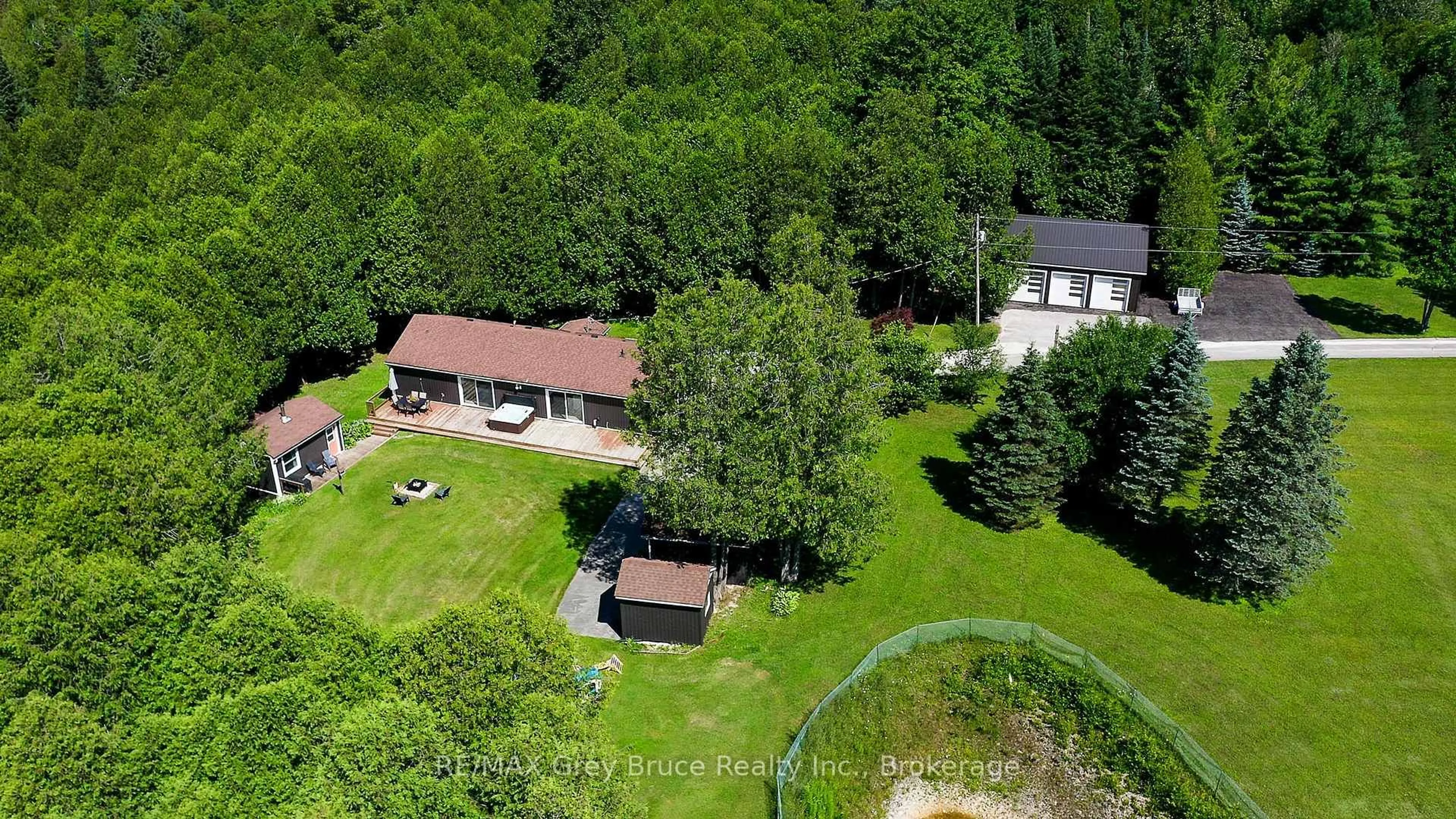 A pic from outside/outdoor area/front of a property/back of a property/a pic from drone, forest/trees view for 495204 Traverston Rd, West Grey Ontario N0C 1H0