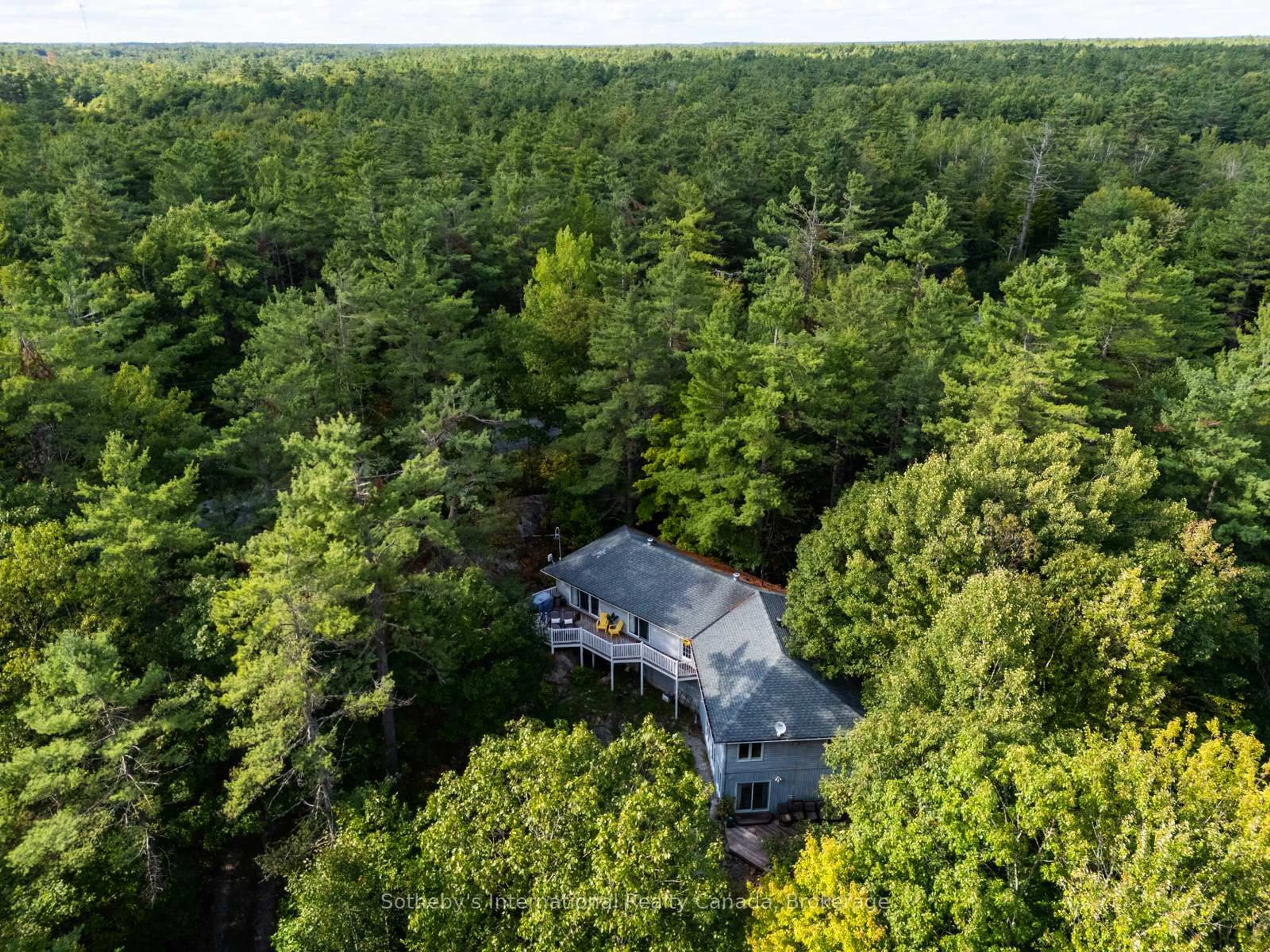 A pic from outside/outdoor area/front of a property/back of a property/a pic from drone, forest/trees view for 1060 North Kahshe Lake Rd, Gravenhurst Ontario P0E 1G0
