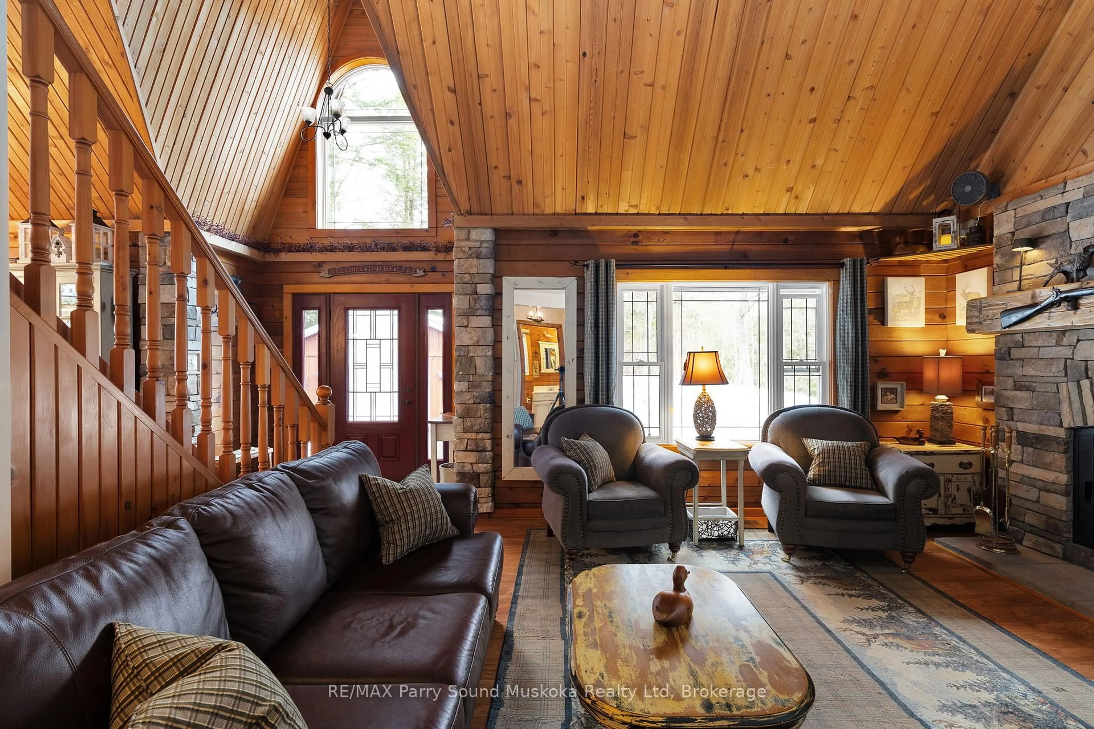 Living room with furniture, wood/laminate floor for 6 West Point Dr, McKellar Ontario P2A 0B5