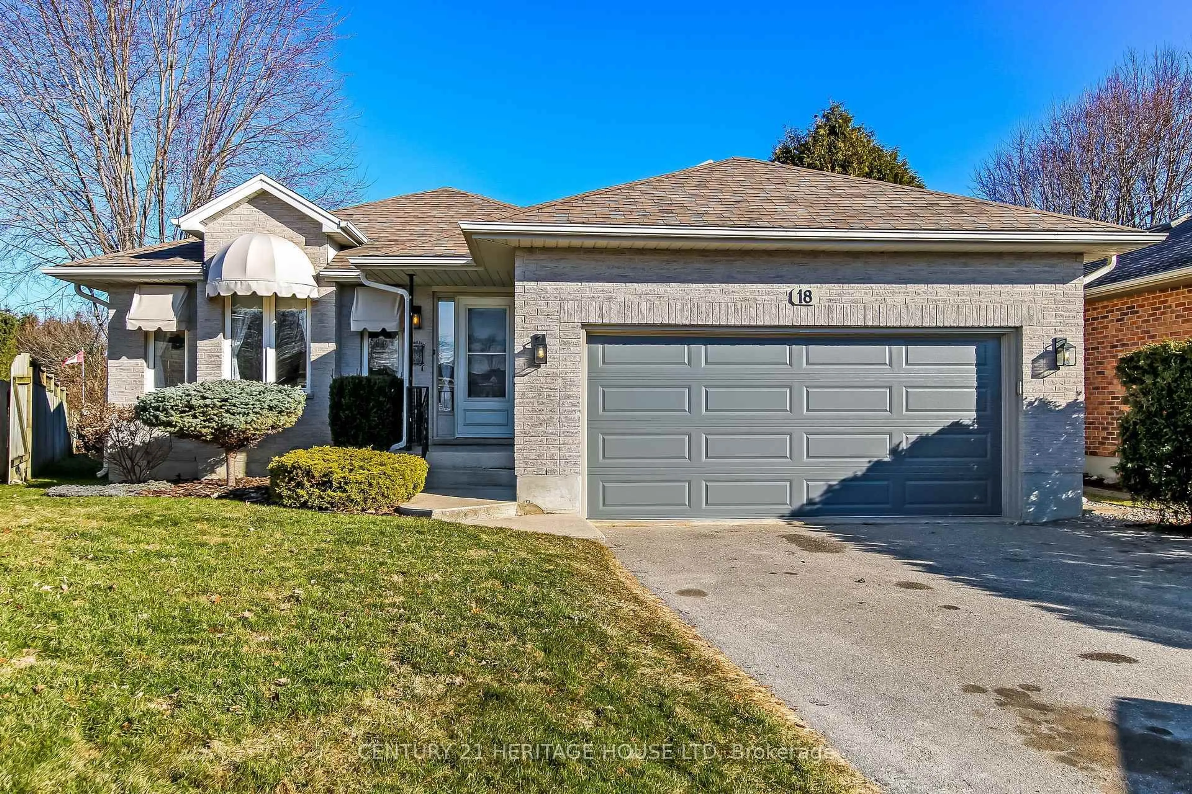 Home with brick exterior material, street for 18 Hickory Blvd, Strathroy-Caradoc Ontario N7G 4A9