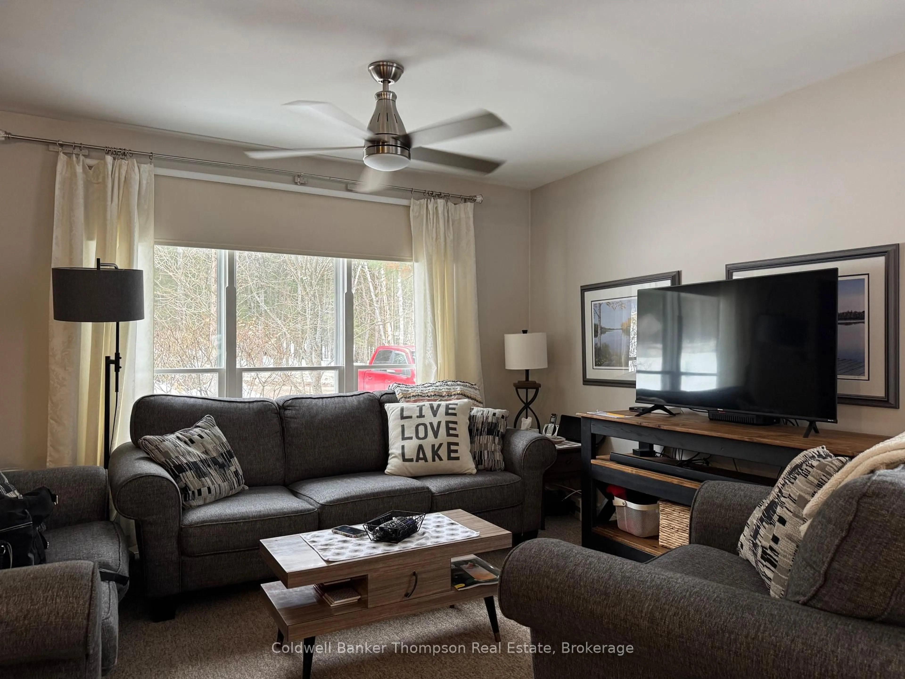 Living room with furniture, wood/laminate floor for 373 Doe Lake Rd, Armour Ontario P0A 1L0