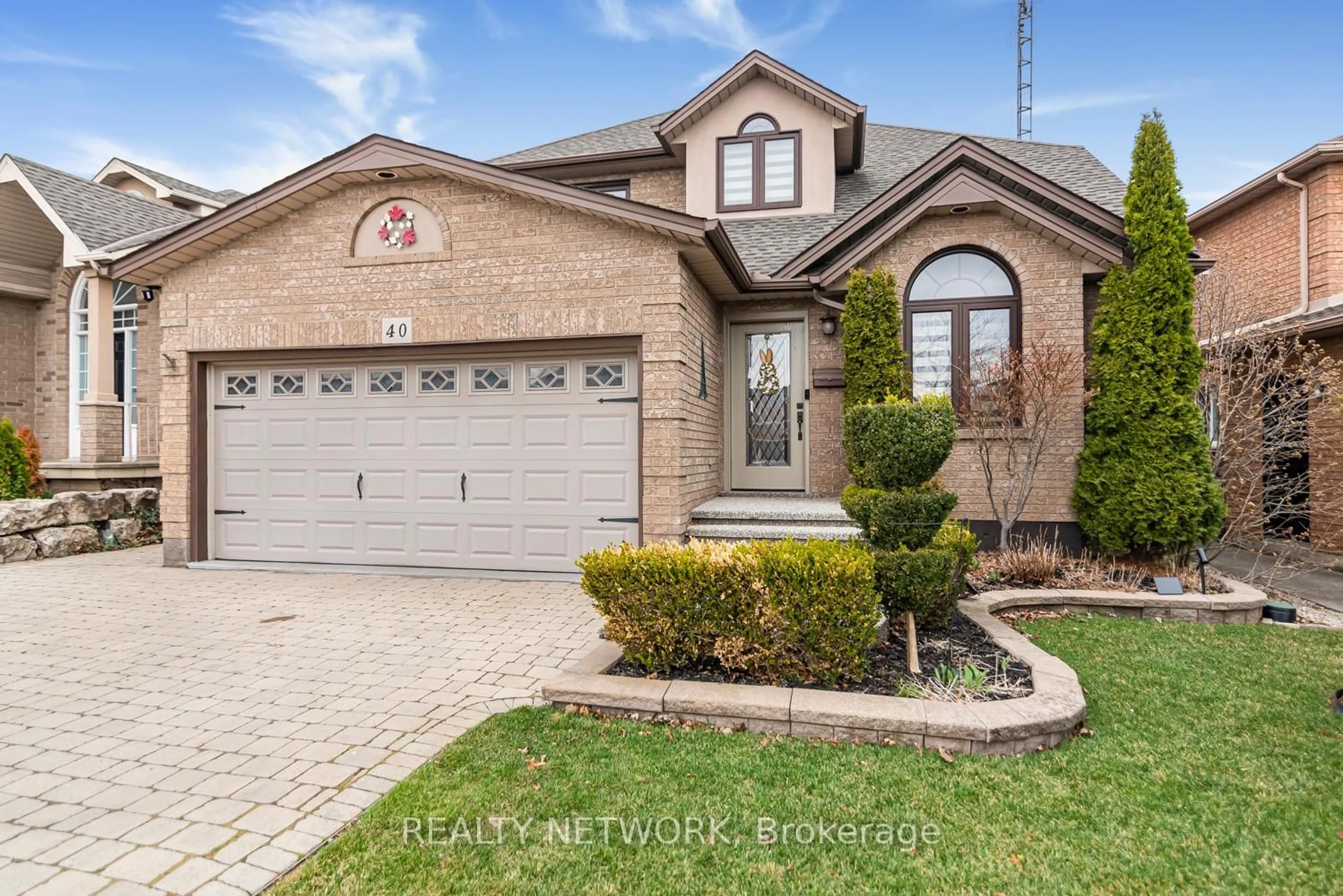 Home with brick exterior material, street for 40 Artistic Blvd, Hamilton Ontario L8T 4Z9