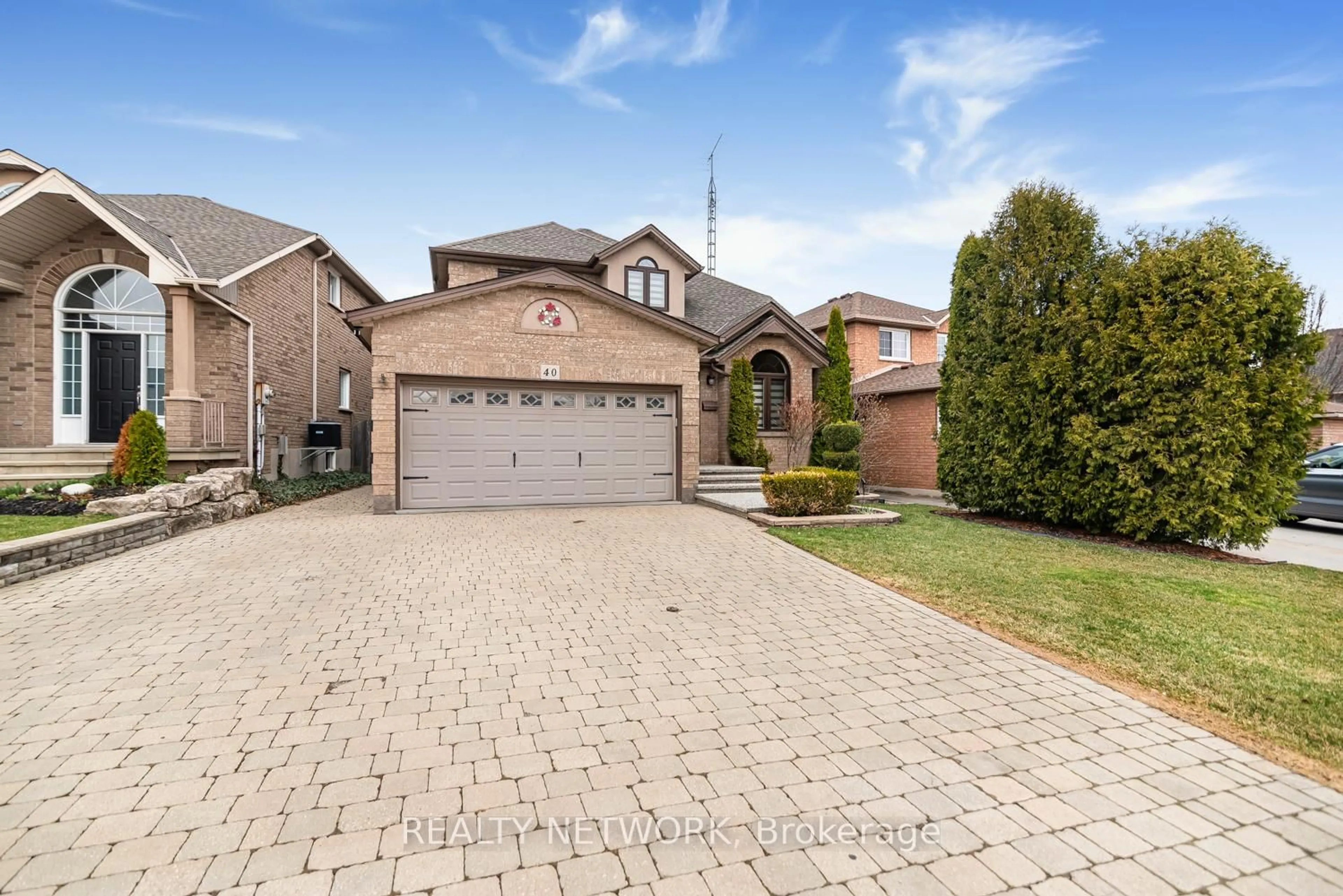 Home with brick exterior material, street for 40 Artistic Blvd, Hamilton Ontario L8T 4Z9
