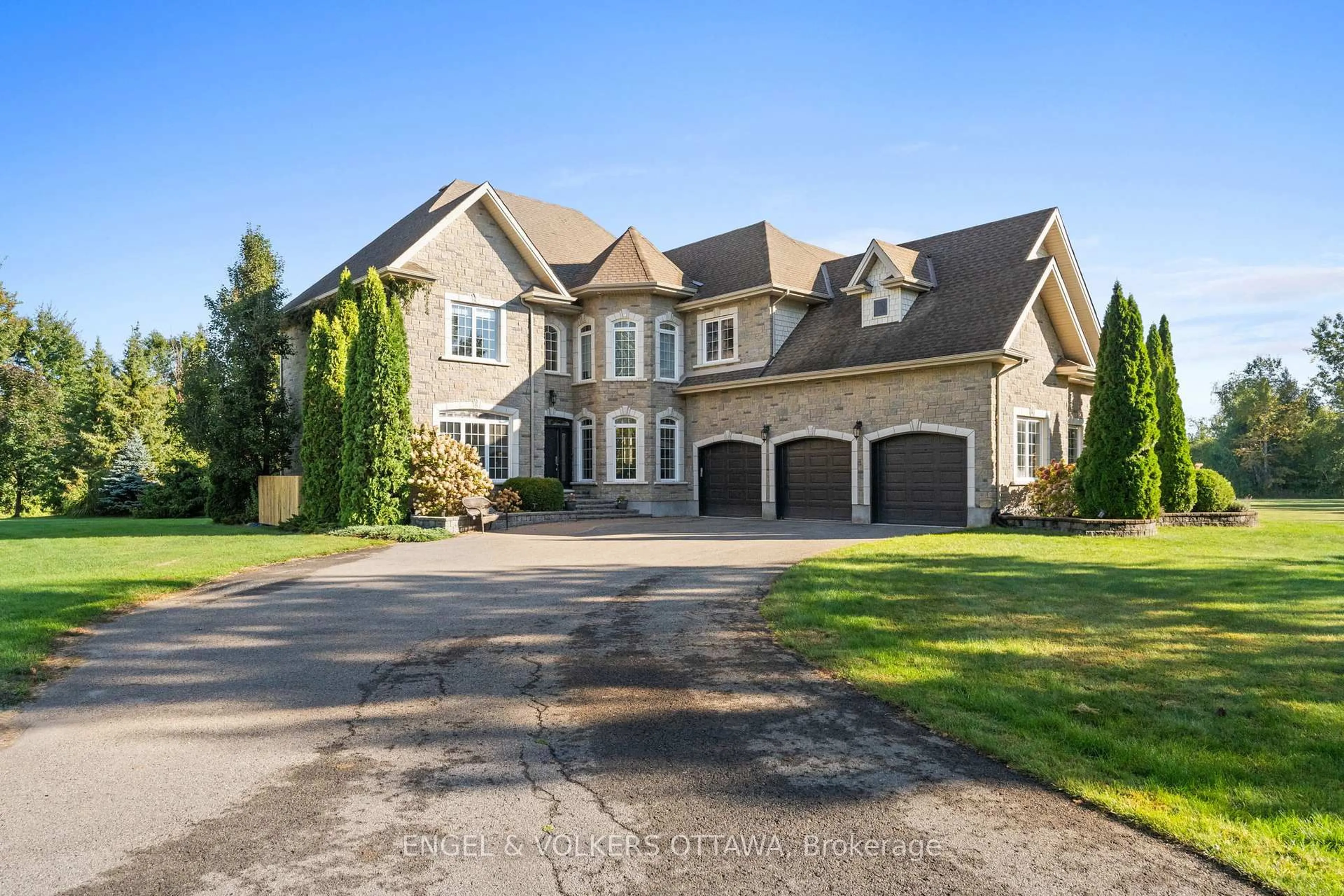 Home with brick exterior material, street for 6227 Pebblewoods Dr, Ottawa Ontario K4P 0A1