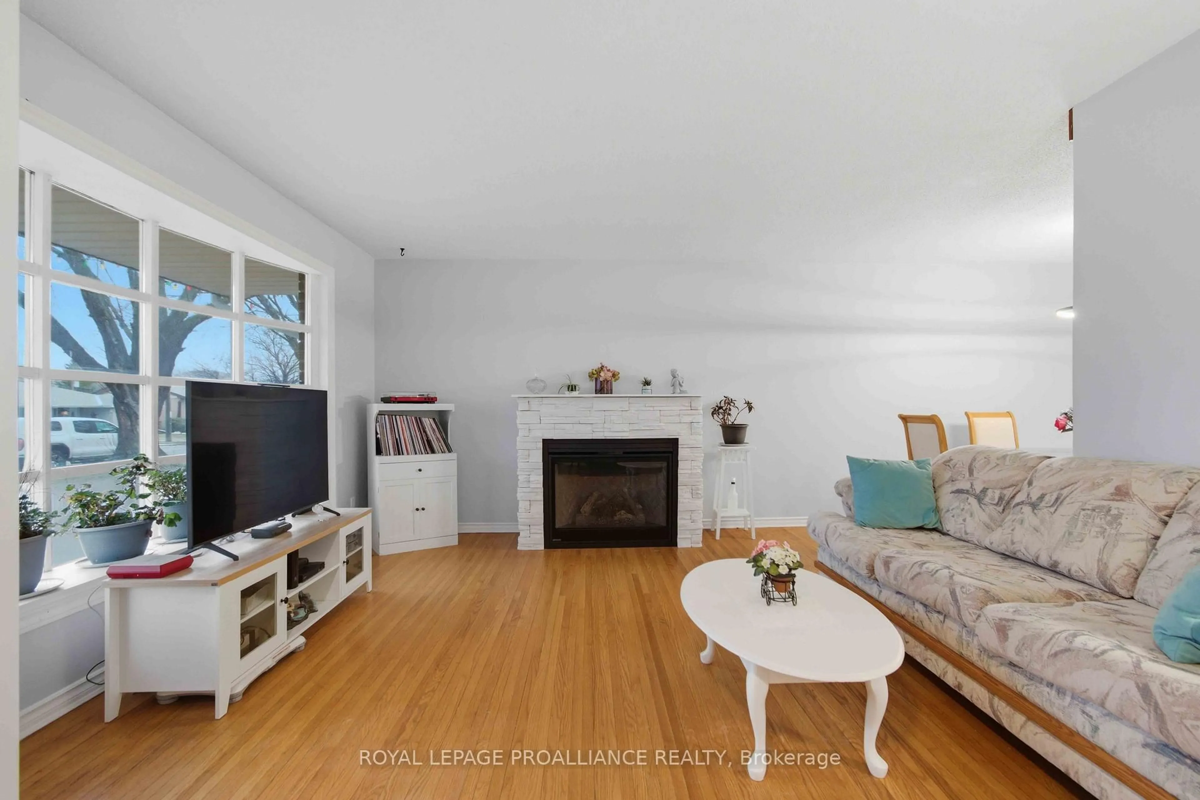 Living room with furniture, wood/laminate floor for 36 Shoniker Ave, Quinte West Ontario K8V 2B5