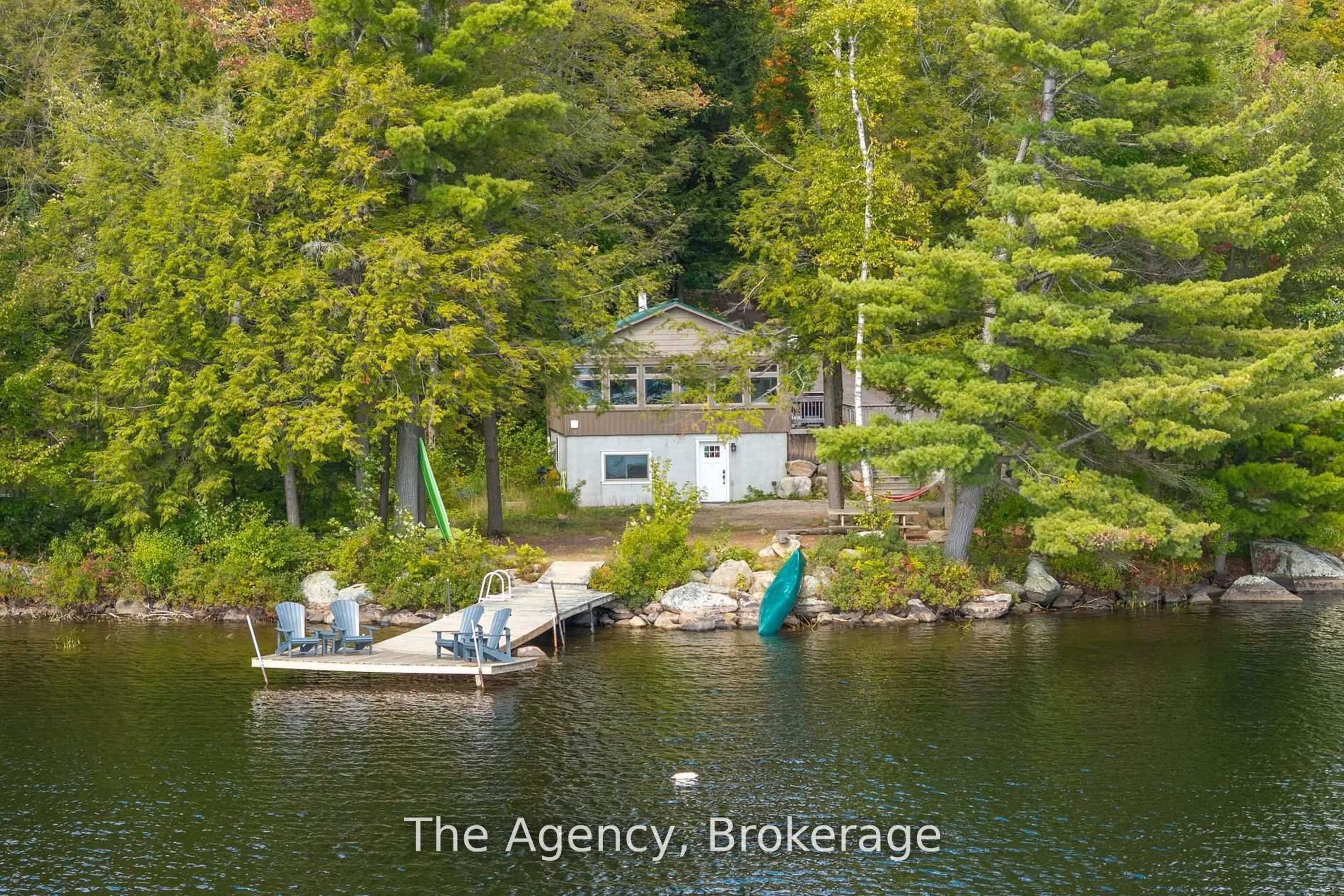 A pic from outside/outdoor area/front of a property/back of a property/a pic from drone, water/lake/river/ocean view for 1032 Lakeshore Dr, Bracebridge Ontario P1L 1X3