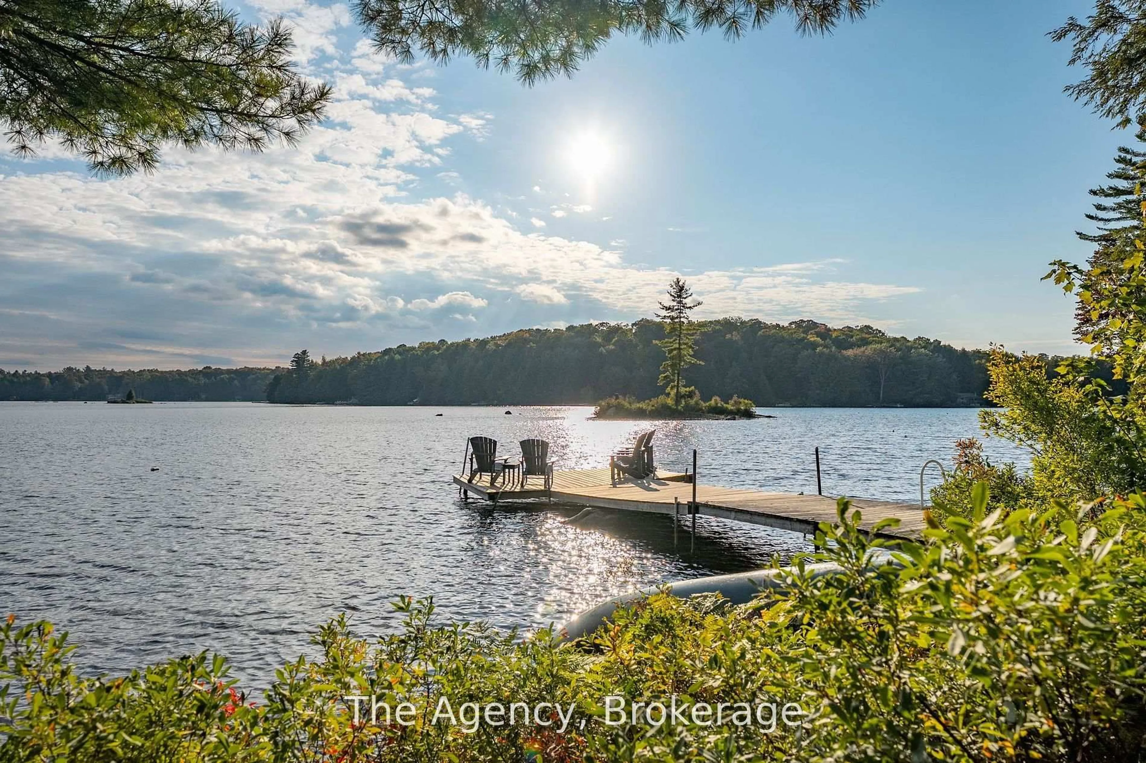 A pic from outside/outdoor area/front of a property/back of a property/a pic from drone, water/lake/river/ocean view for 1032 Lakeshore Dr, Bracebridge Ontario P1L 1X3