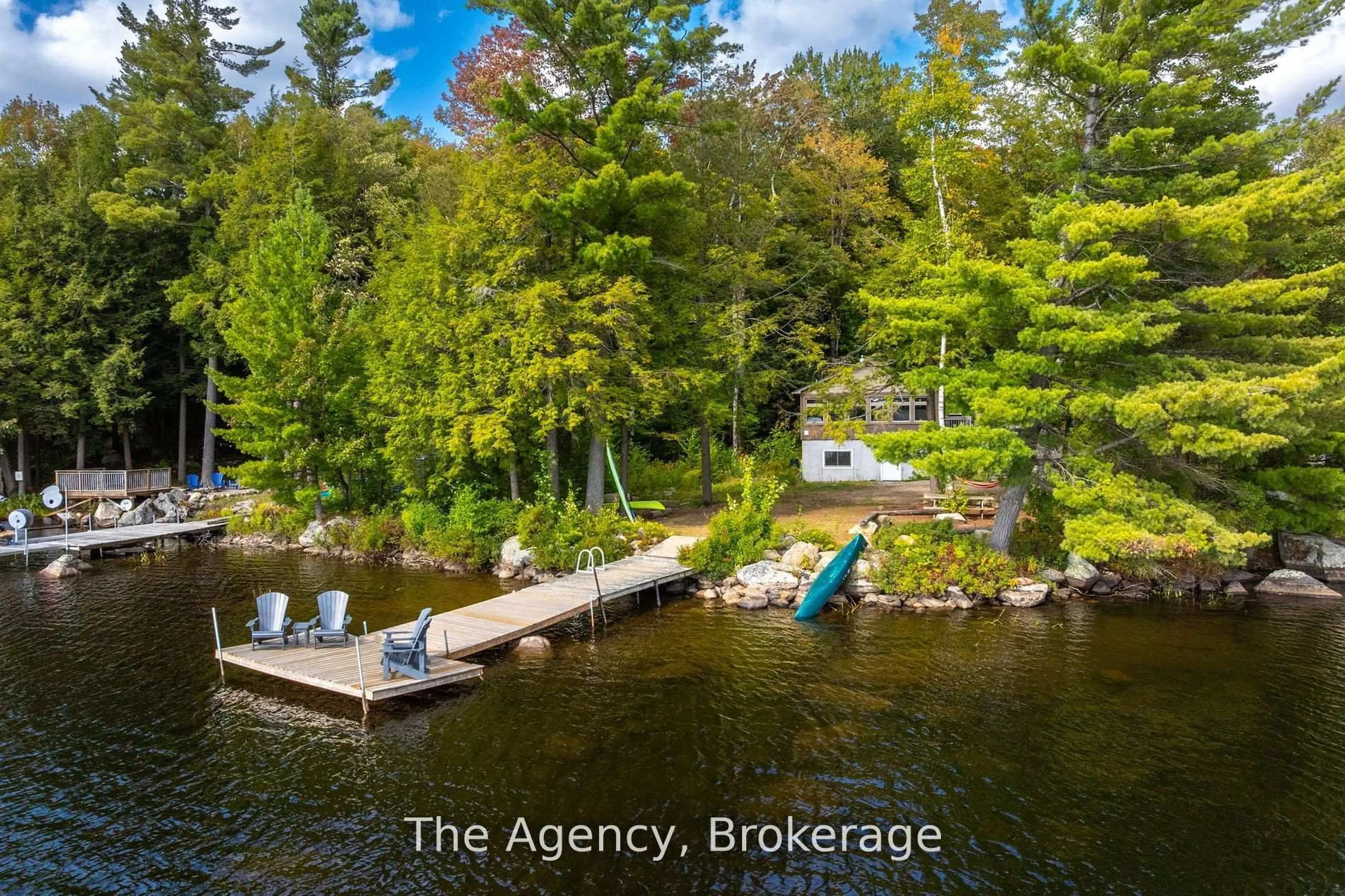 A pic from outside/outdoor area/front of a property/back of a property/a pic from drone, water/lake/river/ocean view for 1032 Lakeshore Dr, Bracebridge Ontario P1L 1X3