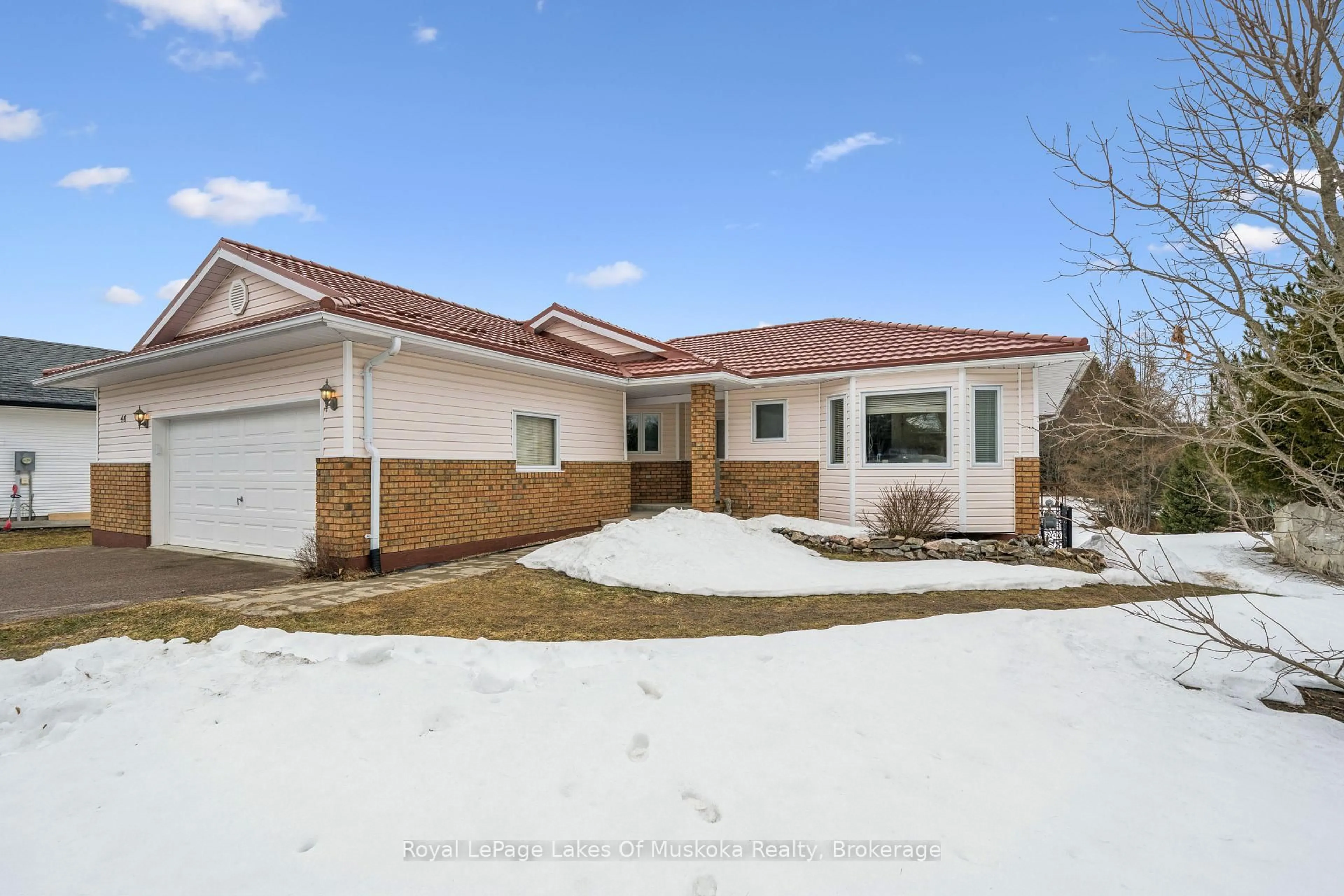 Home with brick exterior material, street for 40 Covered Bridge Tr, Bracebridge Ontario P1L 1Y1