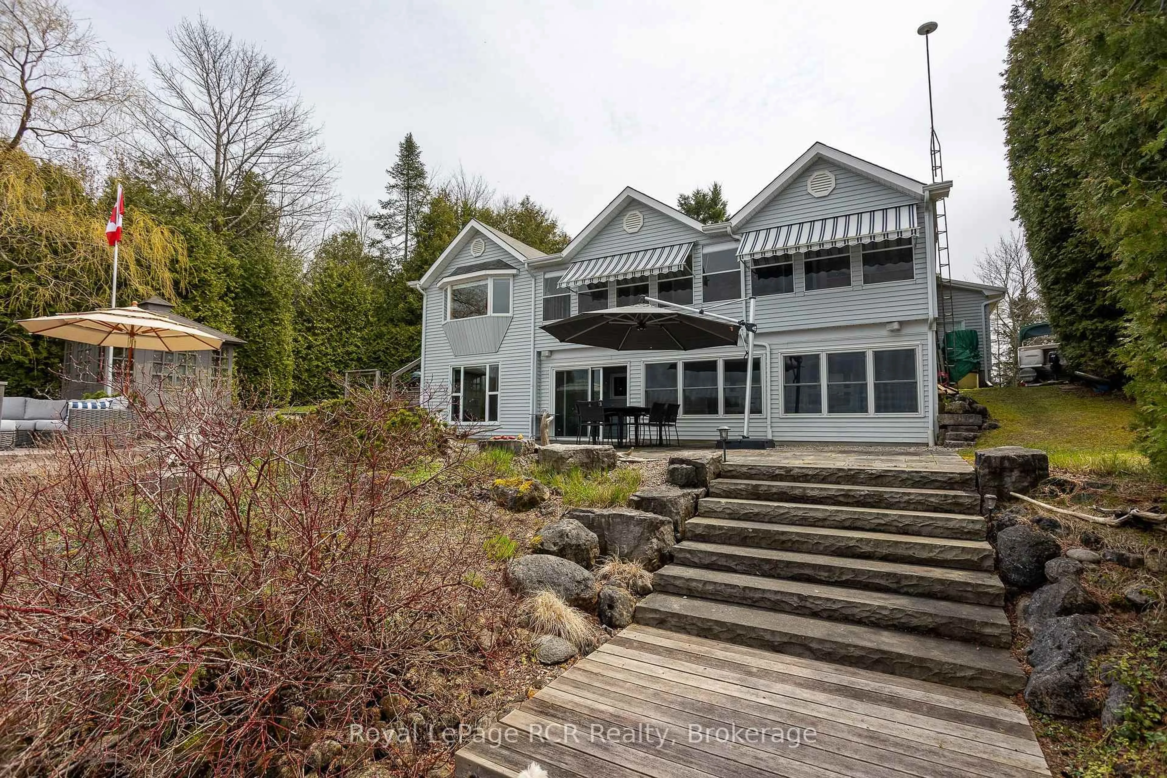 A pic from outside/outdoor area/front of a property/back of a property/a pic from drone, water/lake/river/ocean view for 126 Sunset Pt, Grey Highlands Ontario N0C 1E0