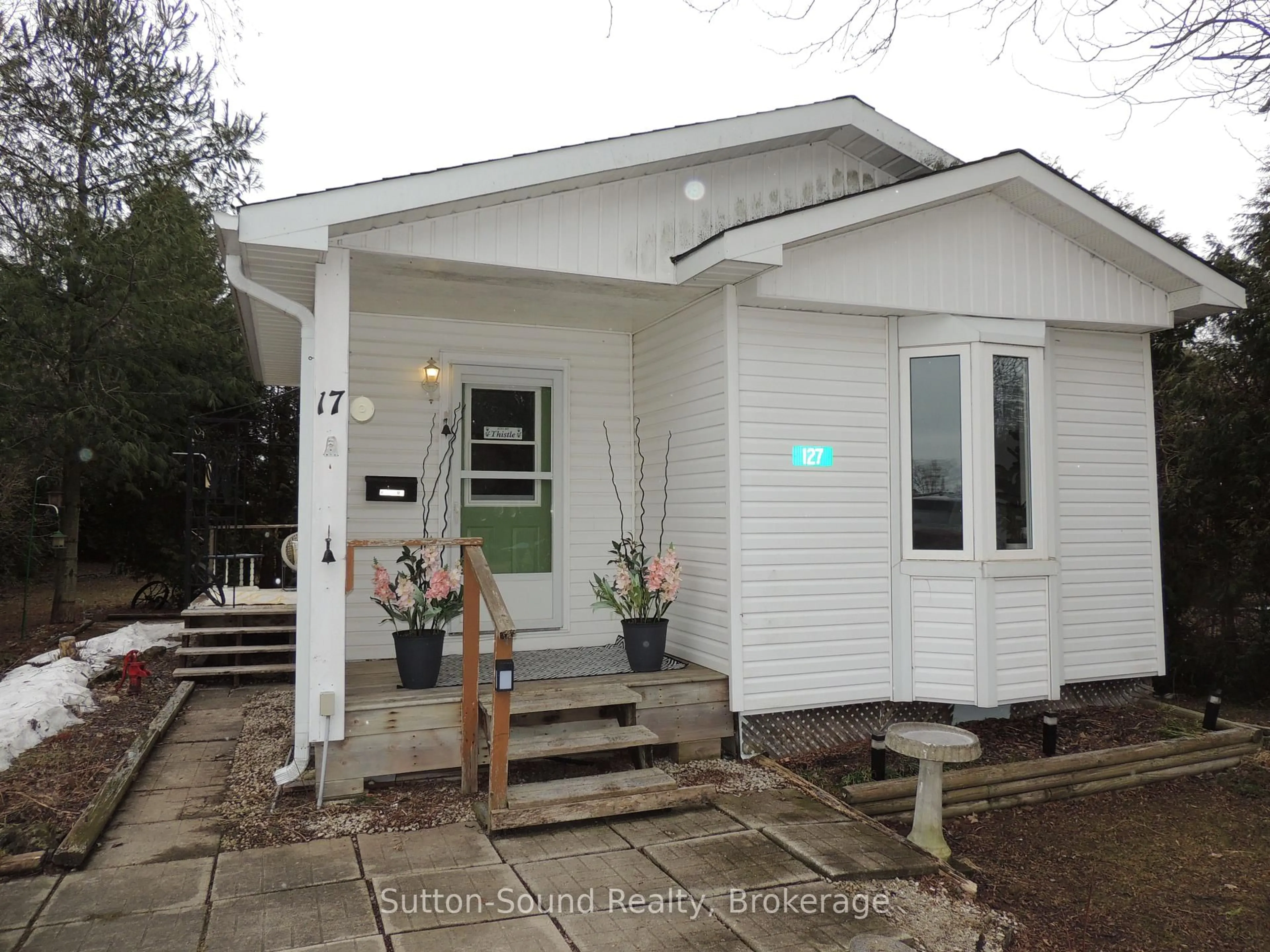 Home with vinyl exterior material, street for 127 Harvey St, Georgian Bluffs Ontario N0H 2N0