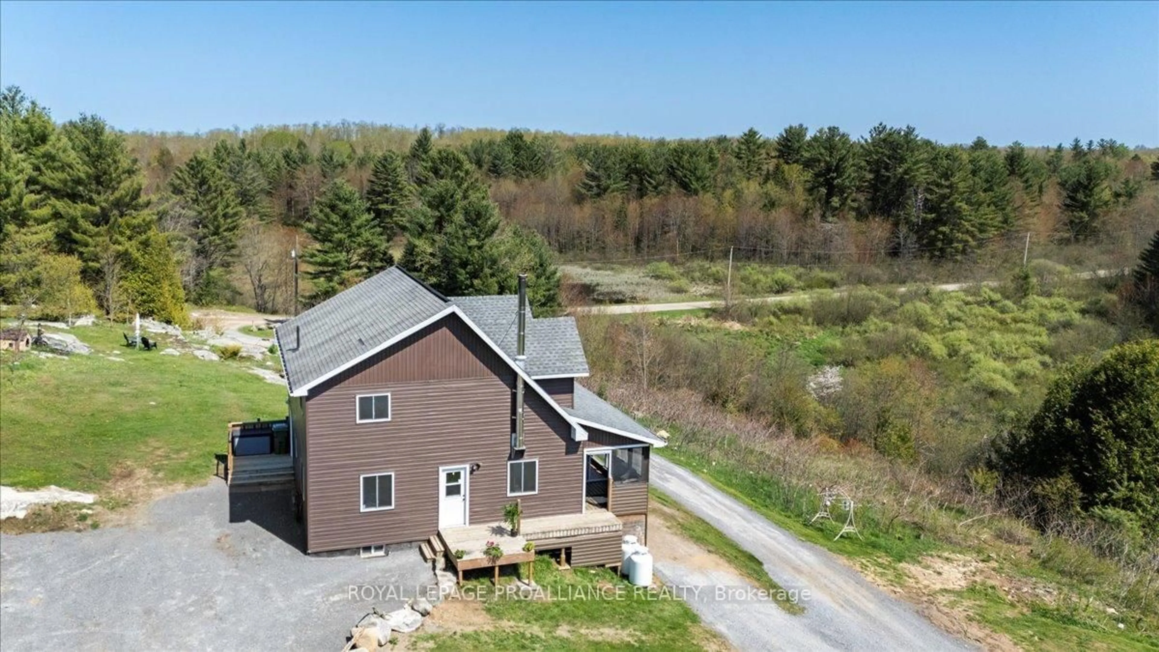 A pic from outside/outdoor area/front of a property/back of a property/a pic from drone, water/lake/river/ocean view for 340 Deer Rock Lake Rd, Kaladar Ontario K0H 1P0