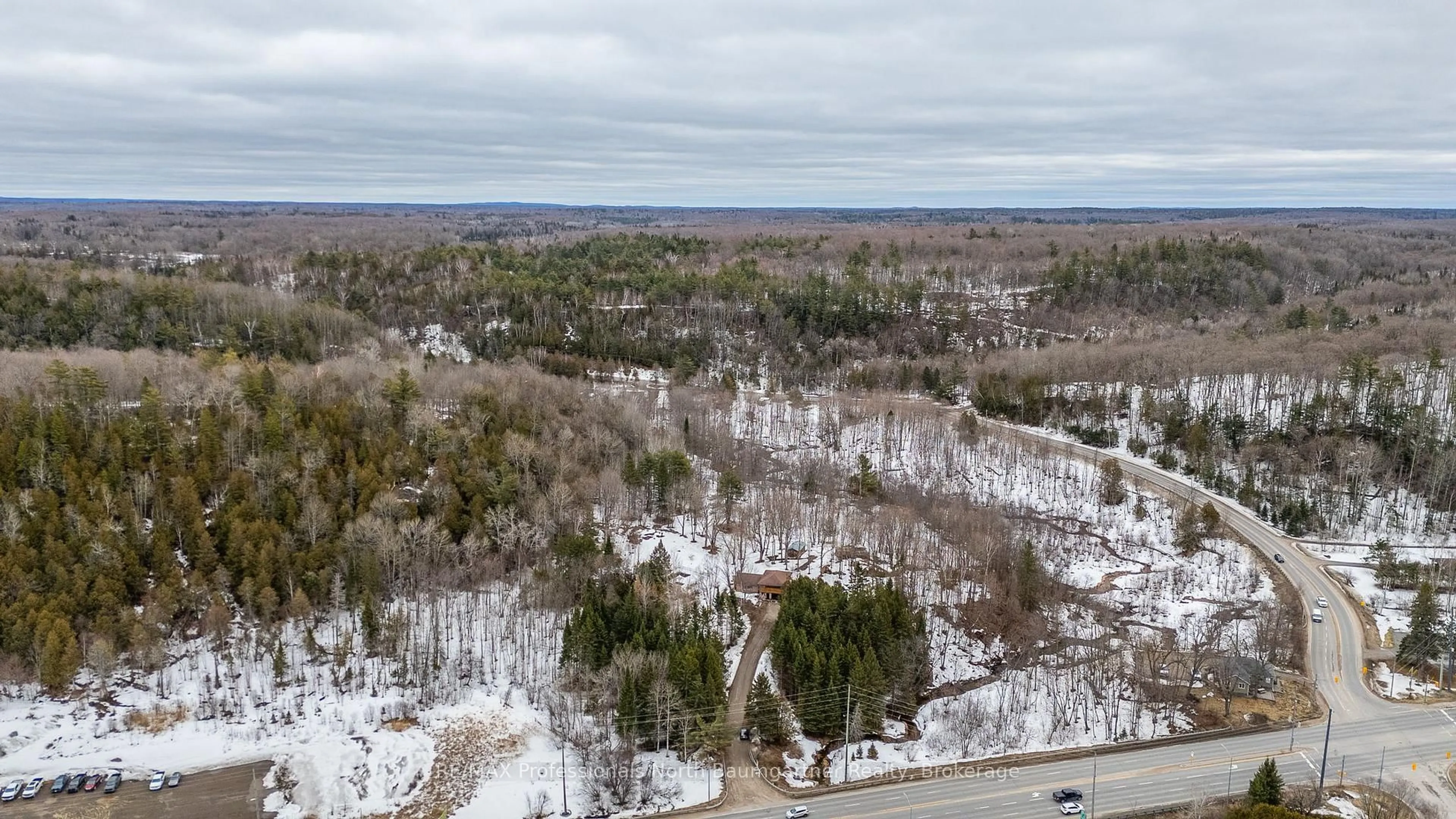 A pic from outside/outdoor area/front of a property/back of a property/a pic from drone, forest/trees view for 12504 Highway 35, Minden Hills Ontario K0M 2K0