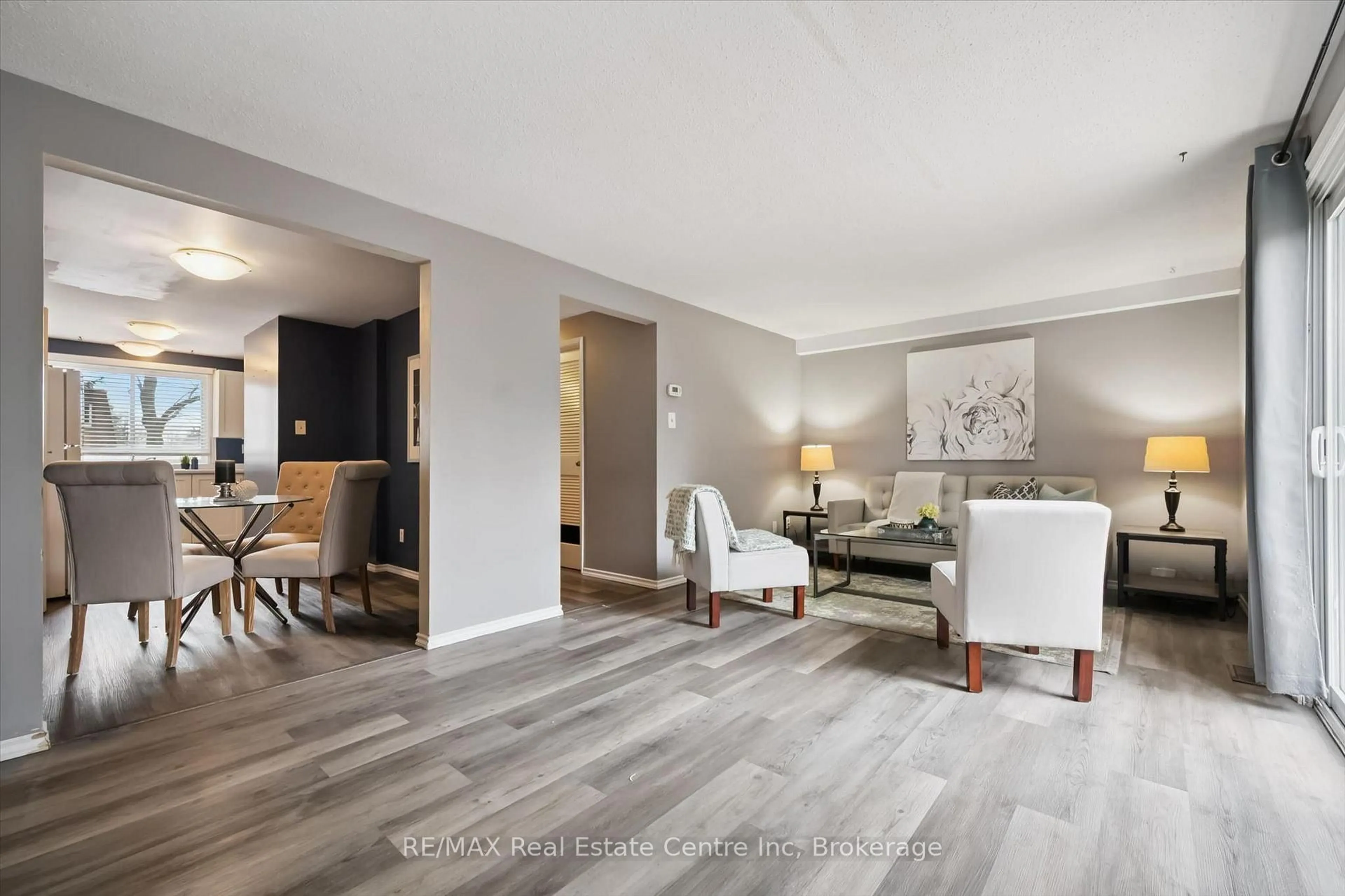 Living room with furniture, wood/laminate floor for 120 COUNTRY CLUB Dr #17, Guelph Ontario N1E 3K7