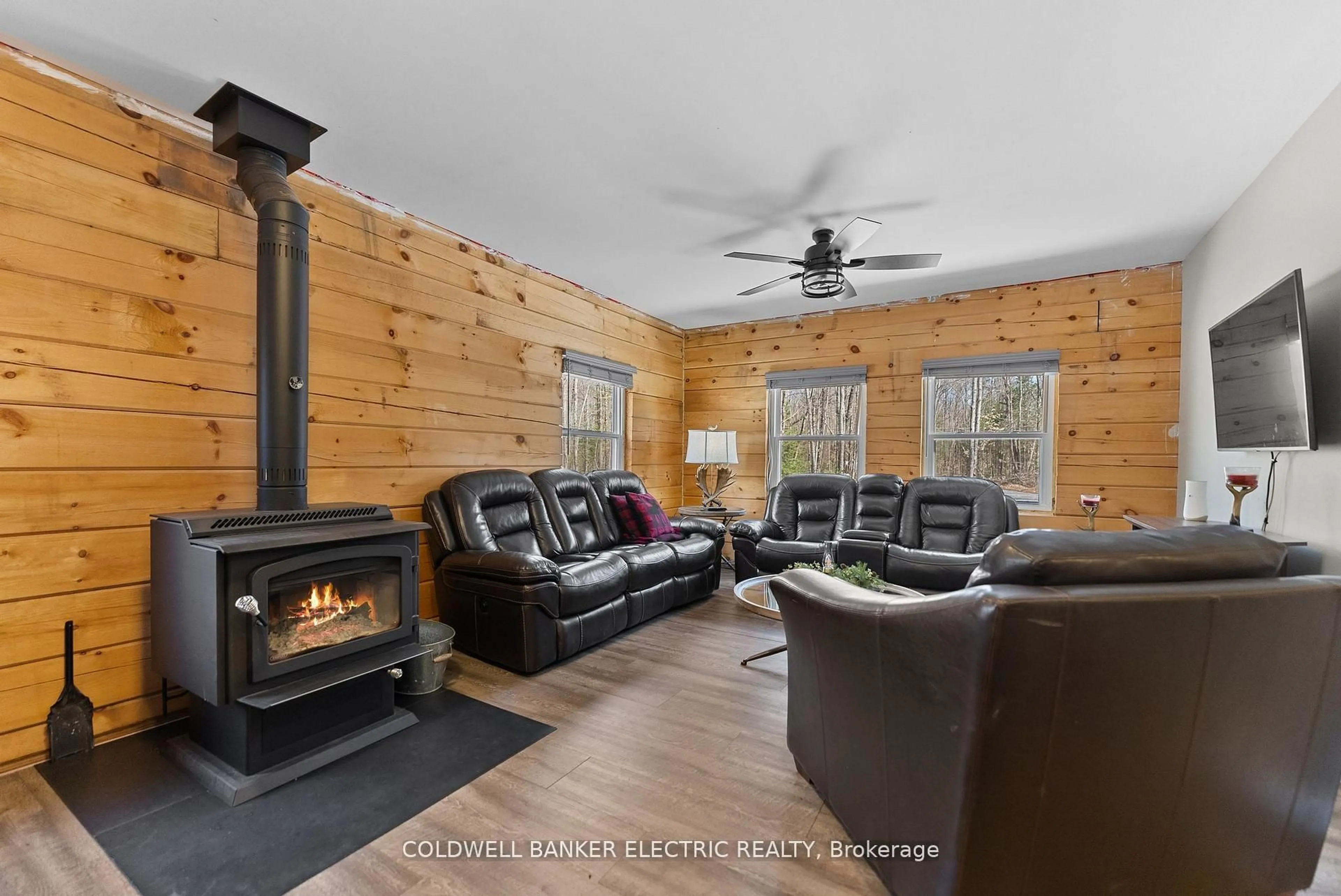 Living room with furniture, wood/laminate floor for 2075 Dyno Rd, Highlands East Ontario K0L 1C0