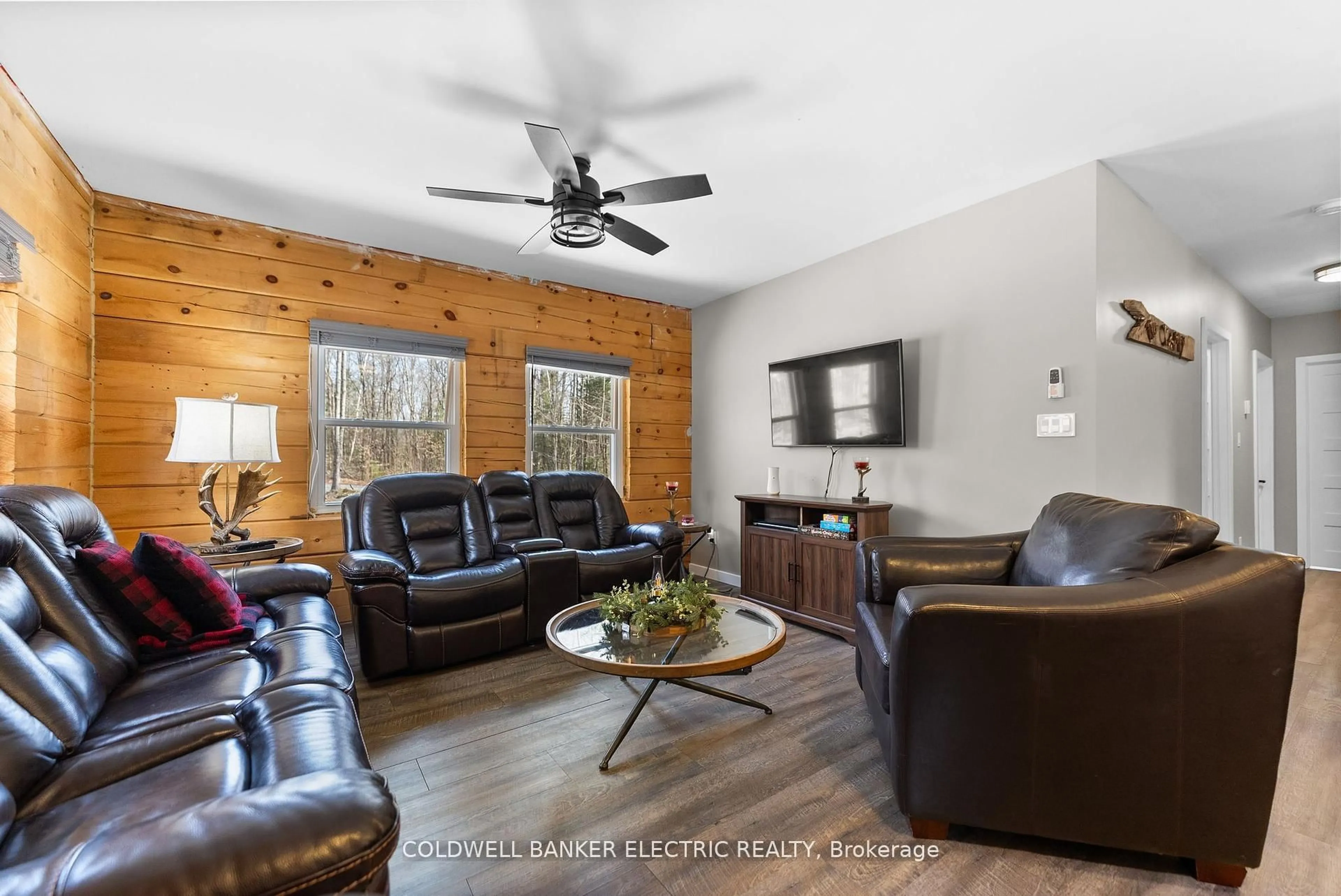 Living room with furniture, wood/laminate floor for 2075 Dyno Rd, Highlands East Ontario K0L 1C0