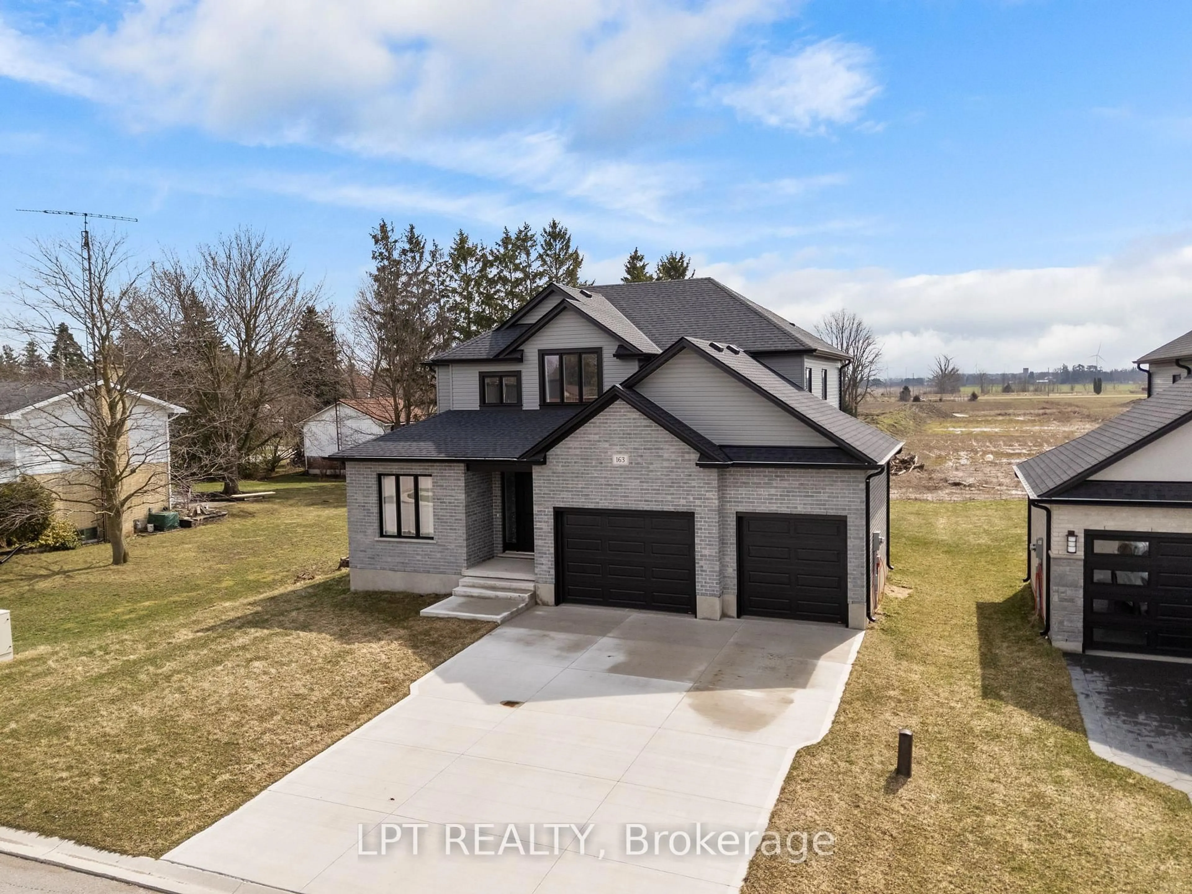 A pic from outside/outdoor area/front of a property/back of a property/a pic from drone, water/lake/river/ocean view for 163 Mcleod St, North Middlesex Ontario N0M 2K0