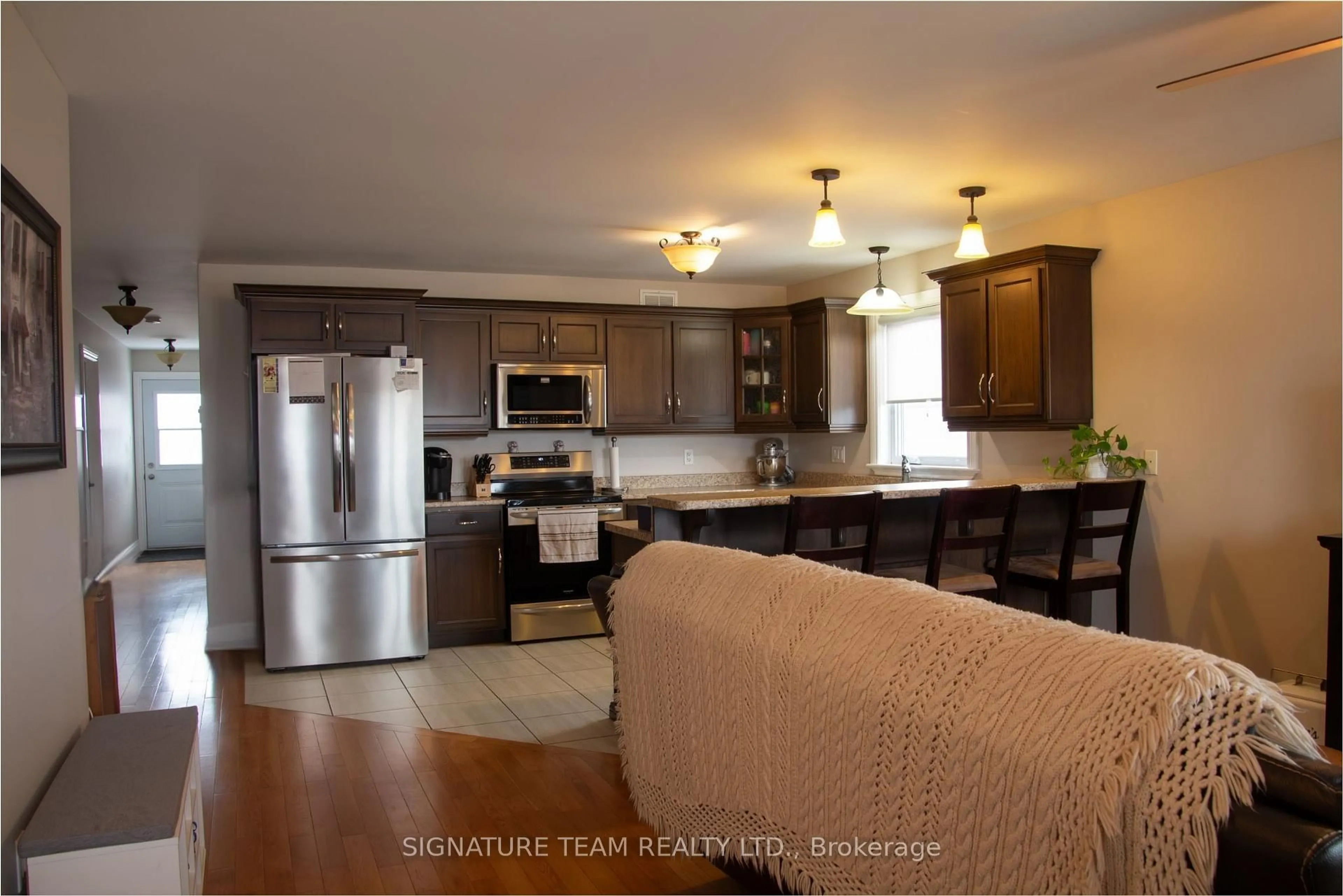 Open concept kitchen, wood/laminate floor for 675 Aberdeen St Aberdeen St, Renfrew Ontario K7V 0A3