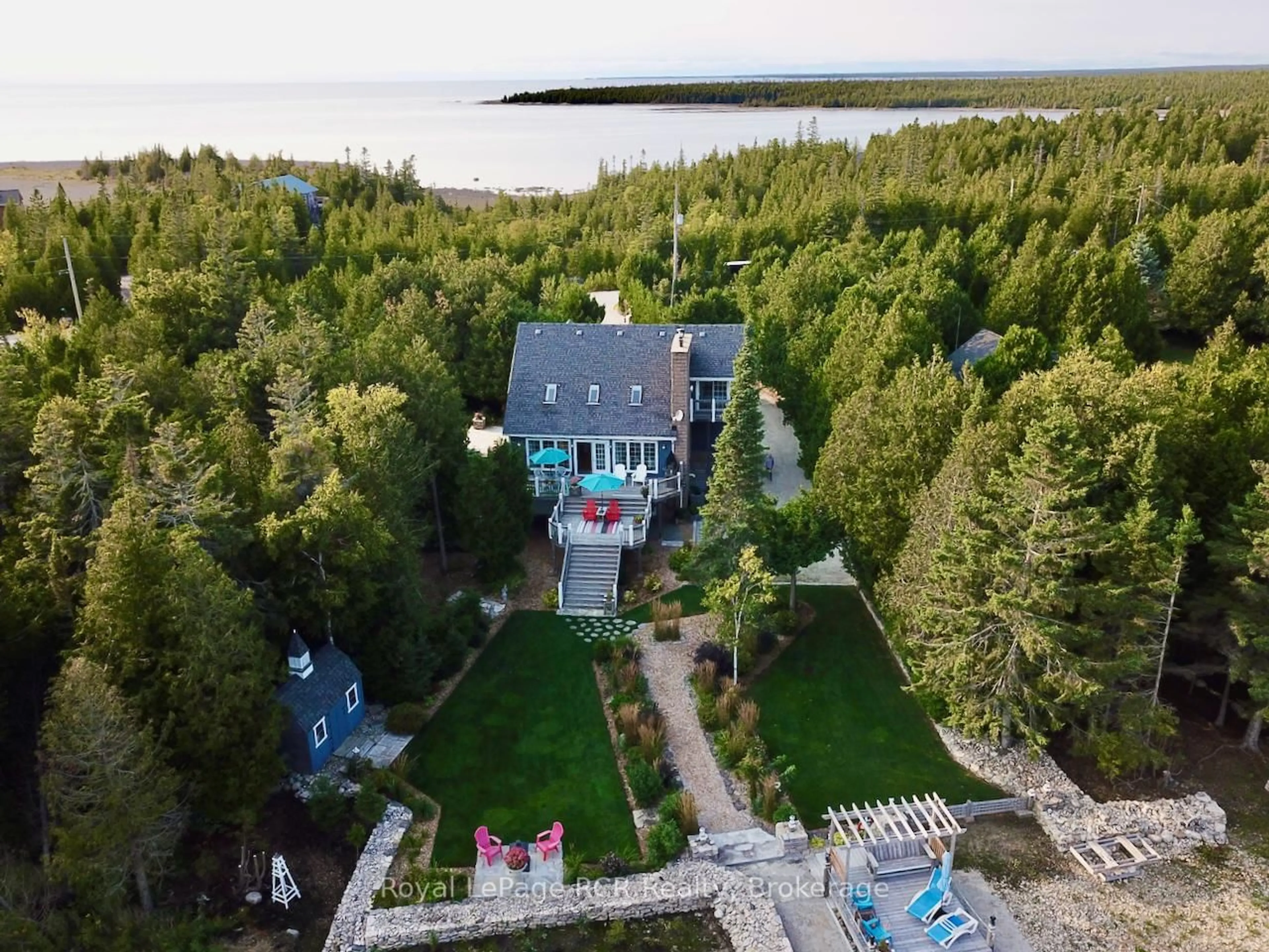 A pic from outside/outdoor area/front of a property/back of a property/a pic from drone, water/lake/river/ocean view for 127 Pine Tree Harbour Rd, Northern Bruce Peninsula Ontario N0H 1Z0