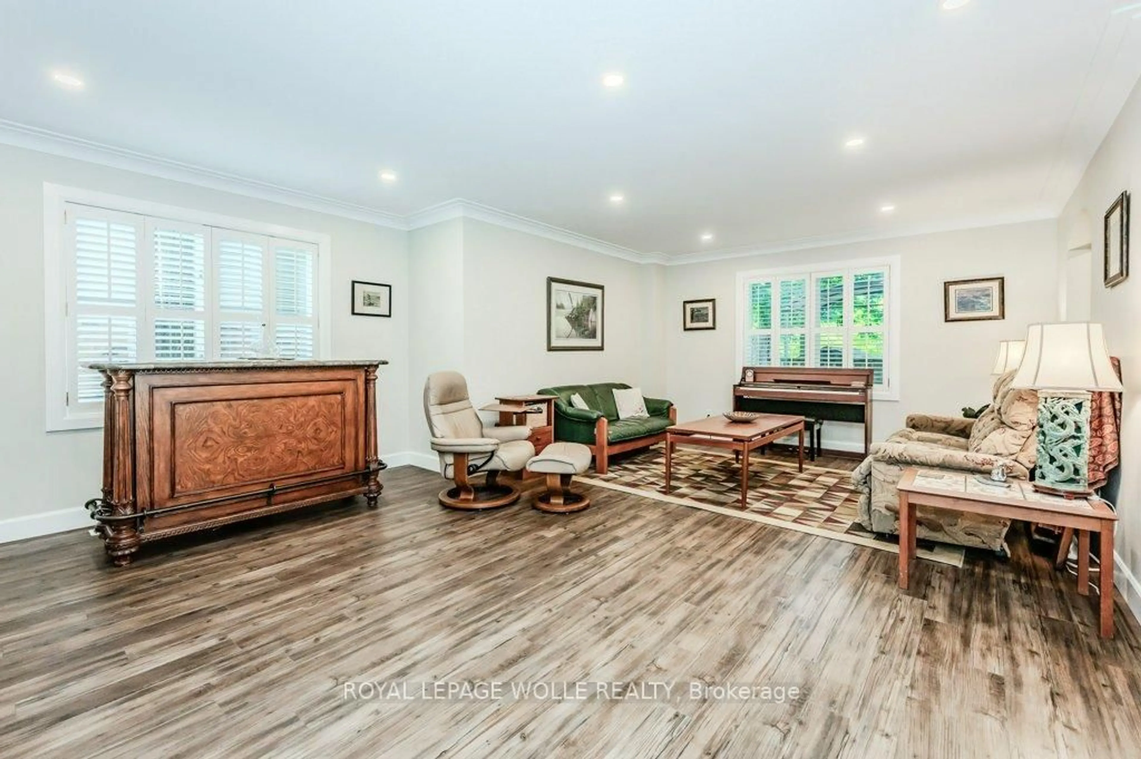 Living room with furniture, wood/laminate floor for 219 Corrie Cres, Waterloo Ontario N2L 5W3