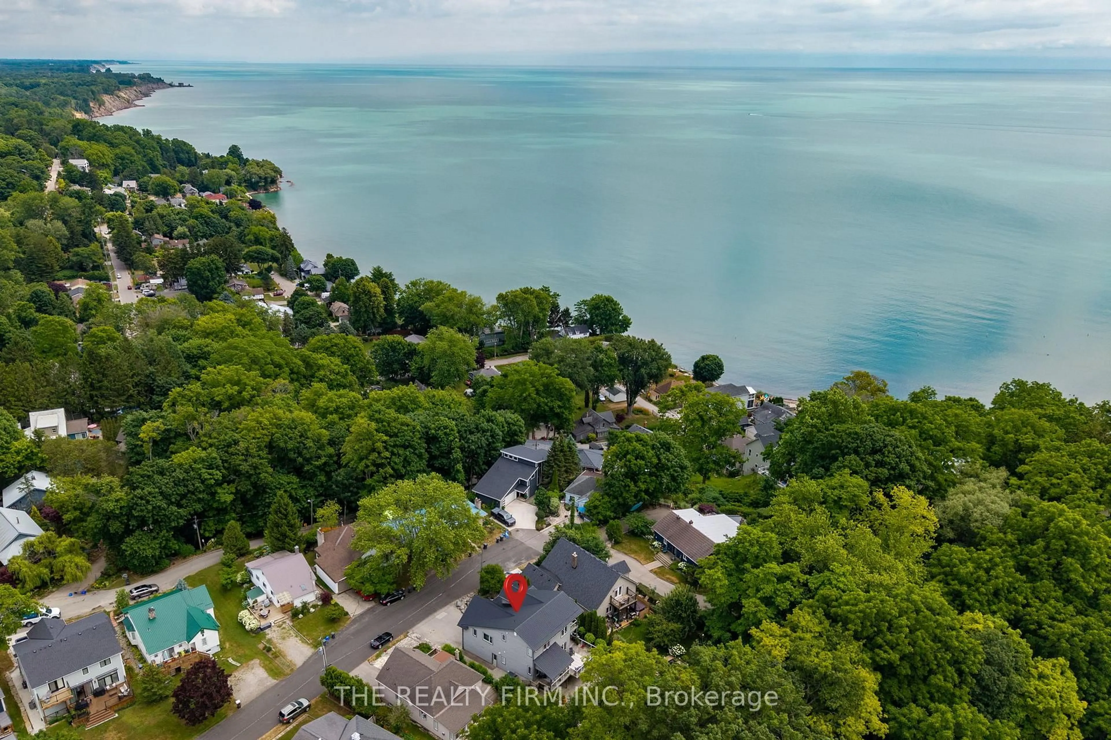 A pic from outside/outdoor area/front of a property/back of a property/a pic from drone, water/lake/river/ocean view for 210 Cornell Dr, Central Elgin Ontario N5L 1A5