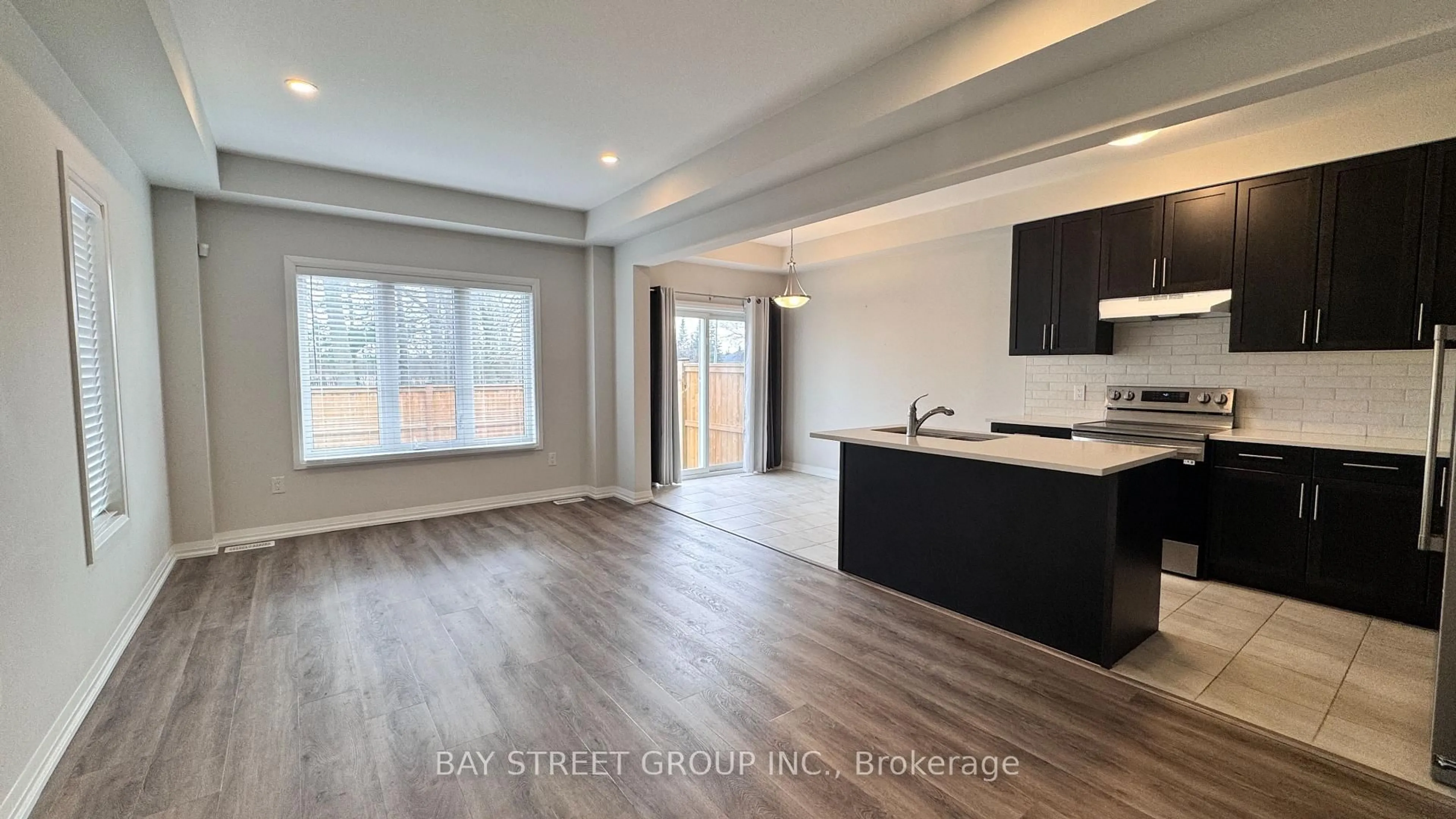Open concept kitchen, wood/laminate floor for 9348 White Oak Ave, Niagara Falls Ontario L2G 3P6