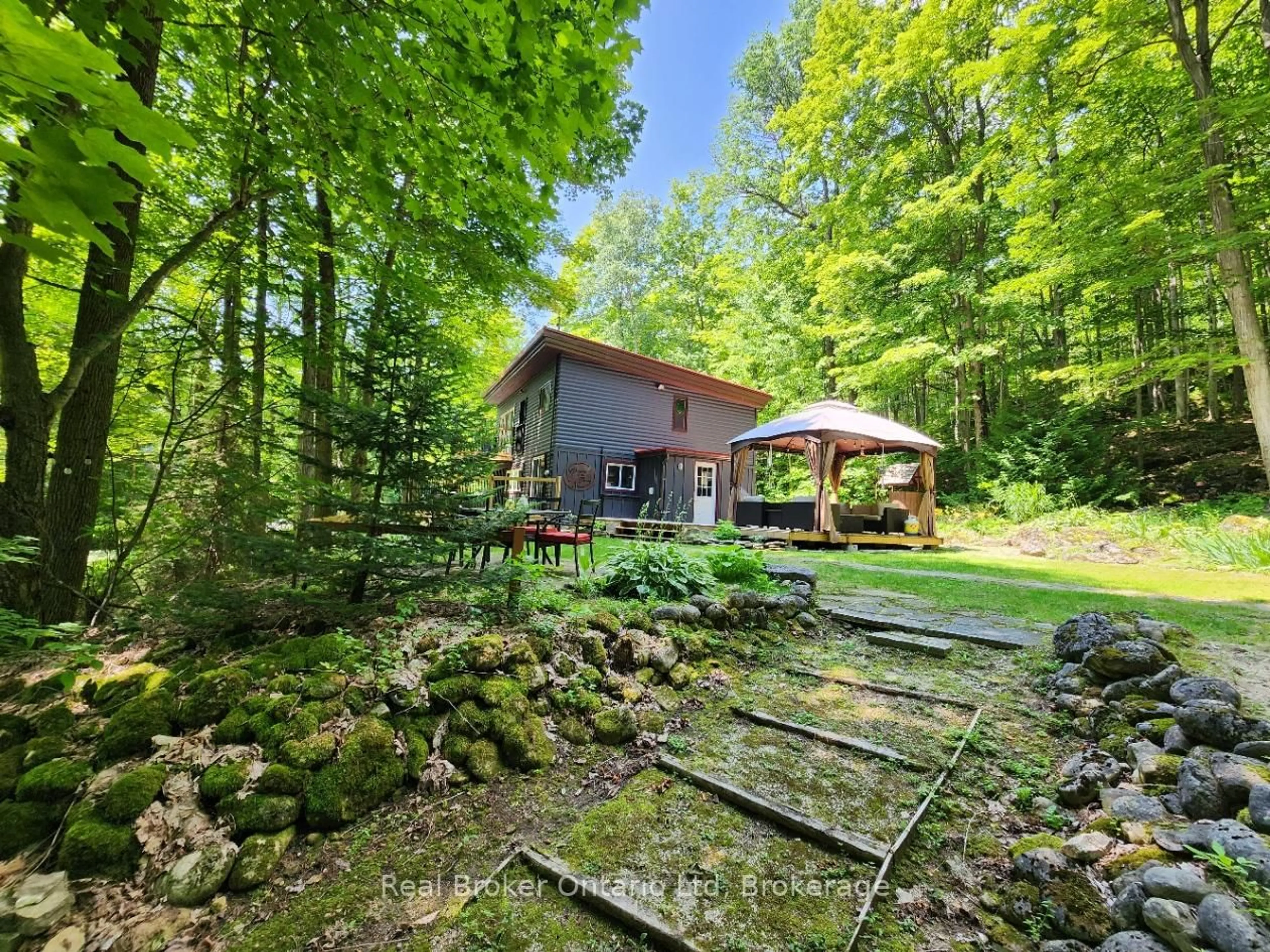 A pic from outside/outdoor area/front of a property/back of a property/a pic from drone, forest/trees view for 12 7th Ave, South Bruce Peninsula Ontario N0H 2T0