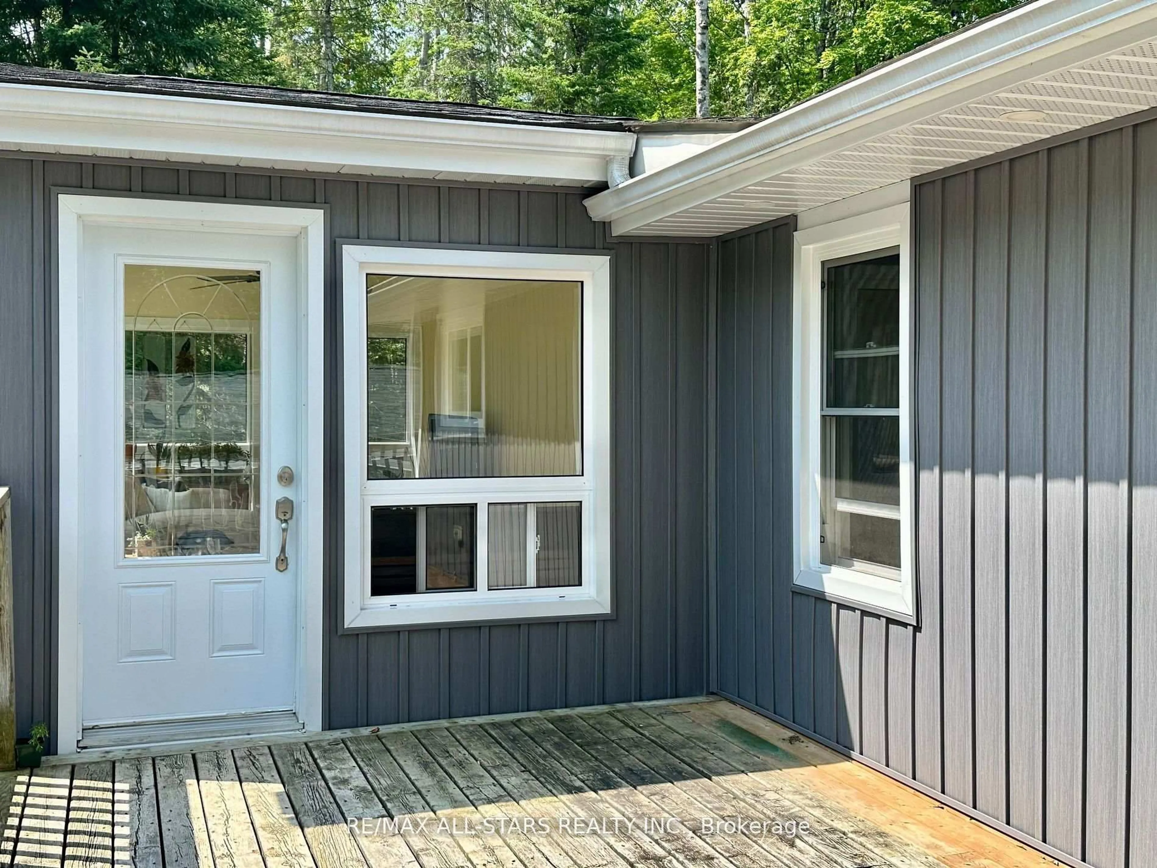 Home with vinyl exterior material, street for 1104 Galway Rd, Trent Lakes Ontario K0M 2A0