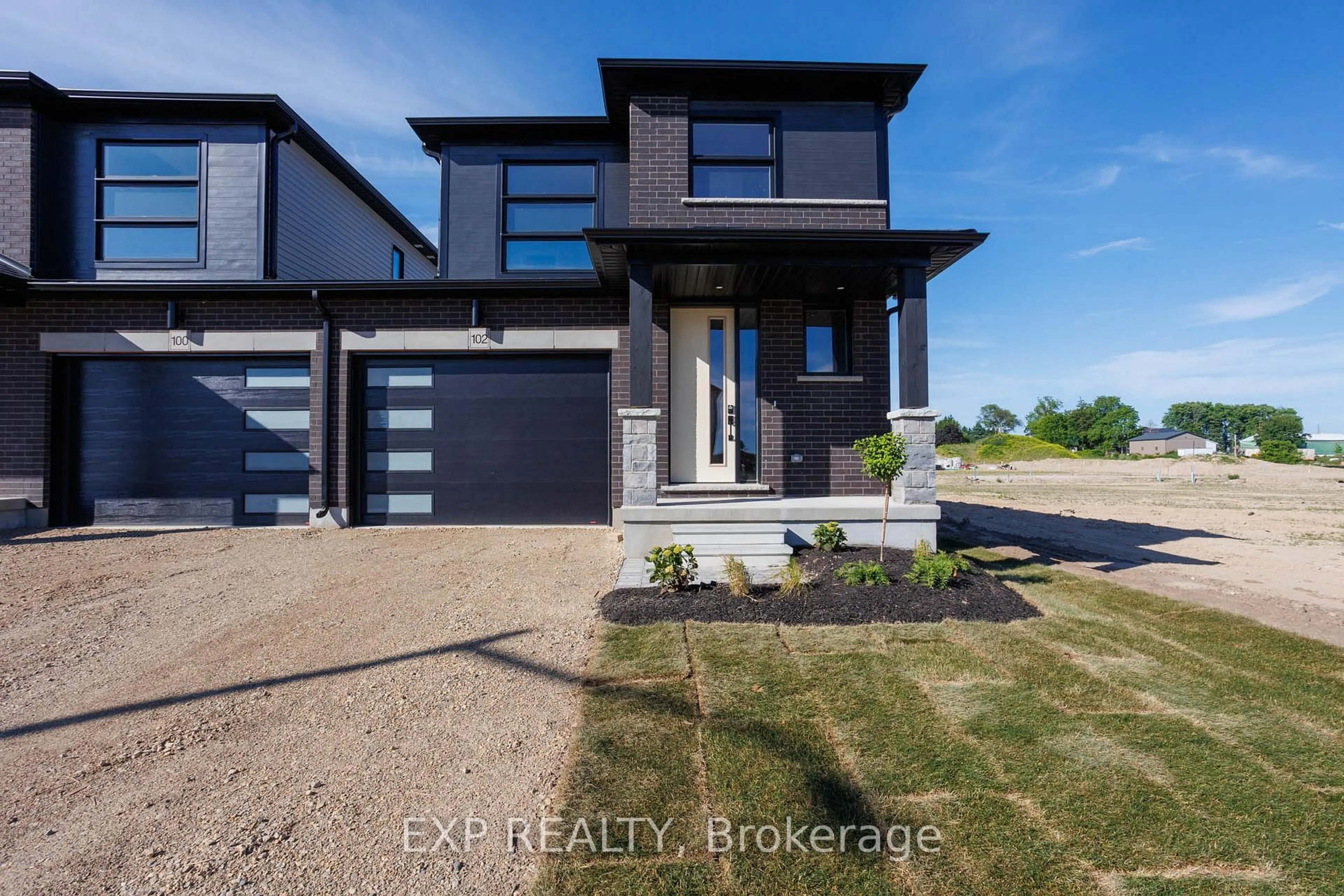 Home with brick exterior material, street for 102 Thackeray Way, Minto Ontario N0G 1Z0