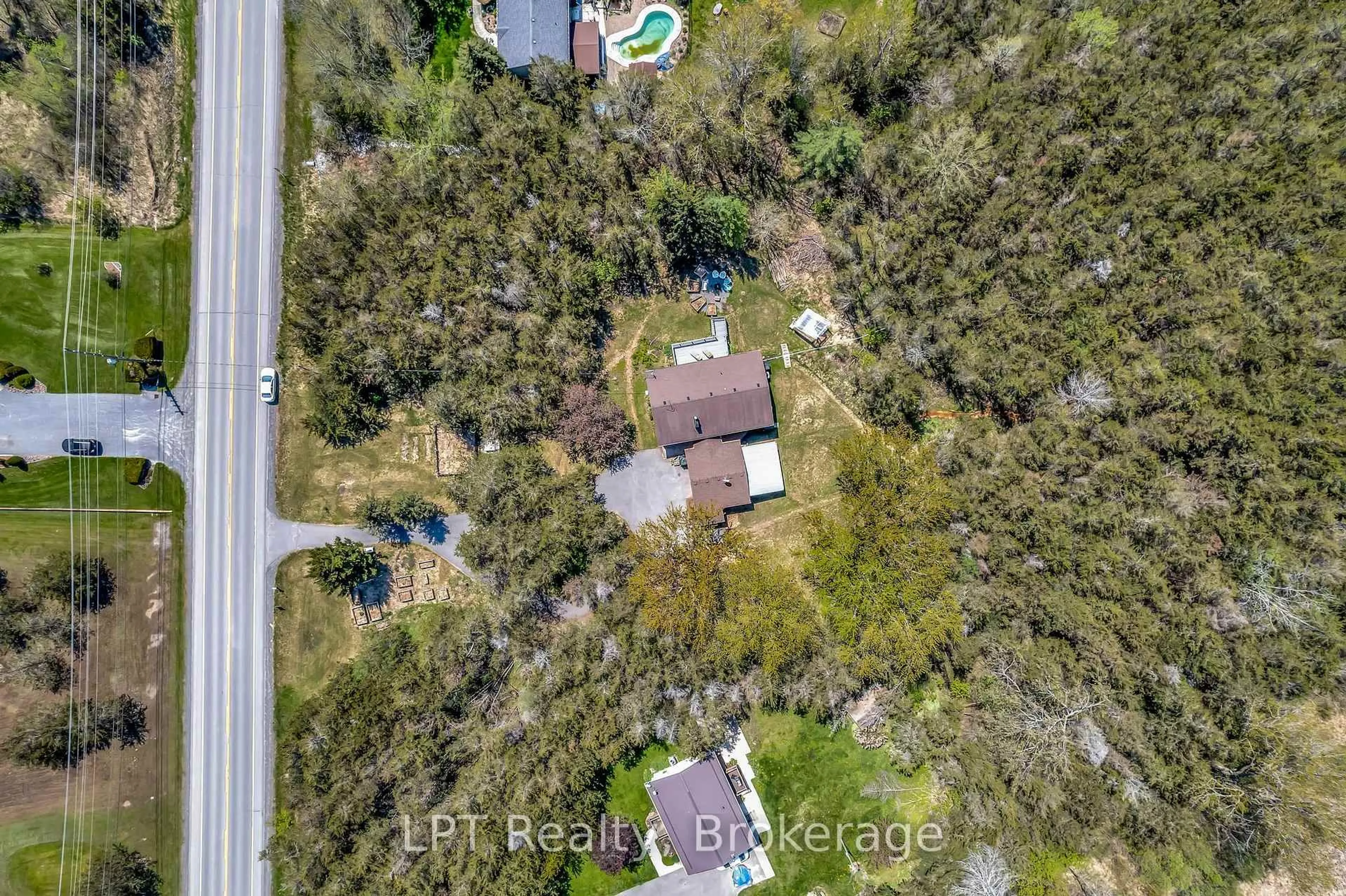 A pic from outside/outdoor area/front of a property/back of a property/a pic from drone, forest/trees view for 1207 County Rd 9 St, Napanee Ontario K7R 3K8