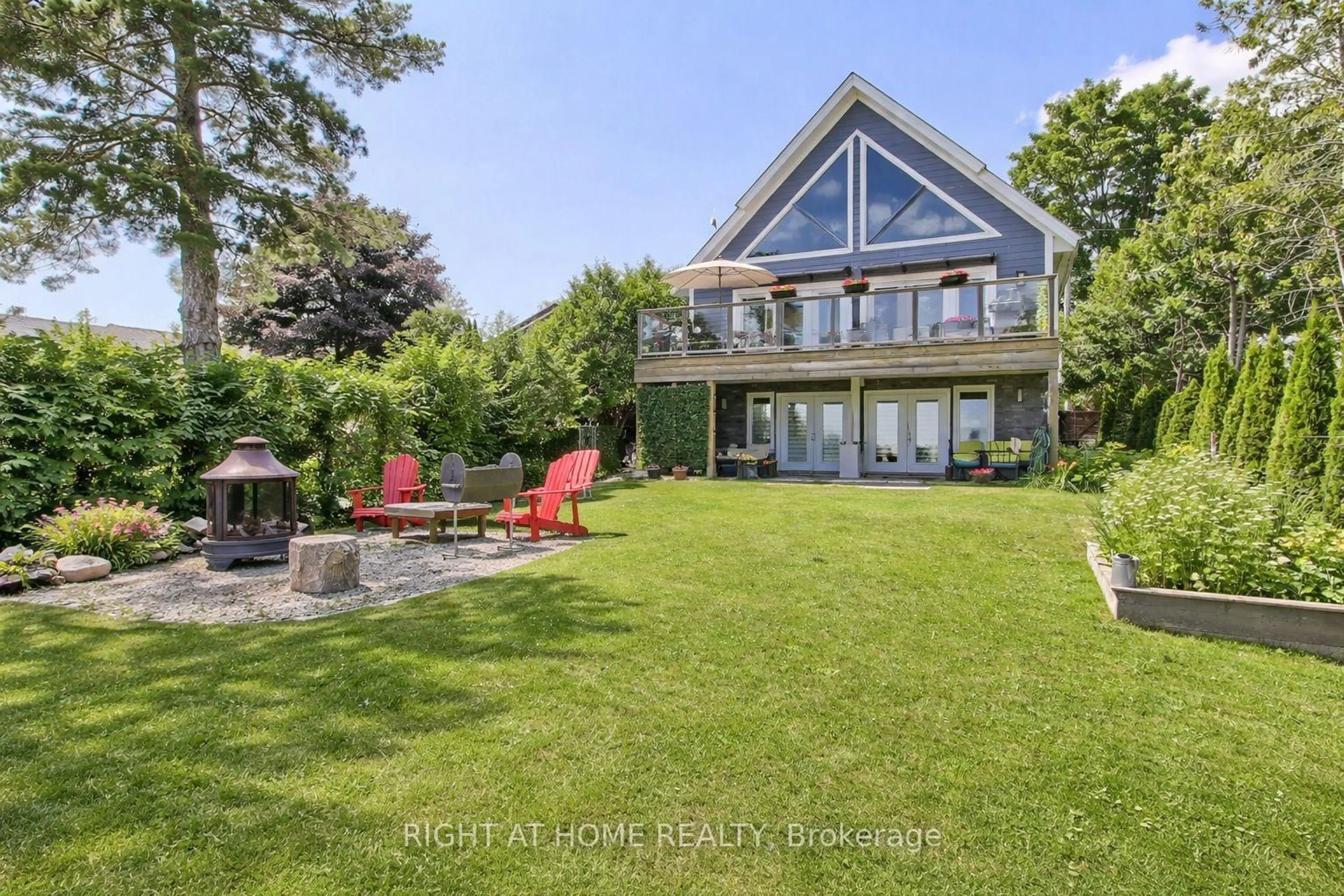 A pic from outside/outdoor area/front of a property/back of a property/a pic from drone, water/lake/river/ocean view for 26 Beach Rd, Kawartha Lakes Ontario K0M 2C0